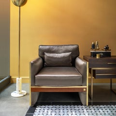 Famosa poltrona con dettagli in ottone