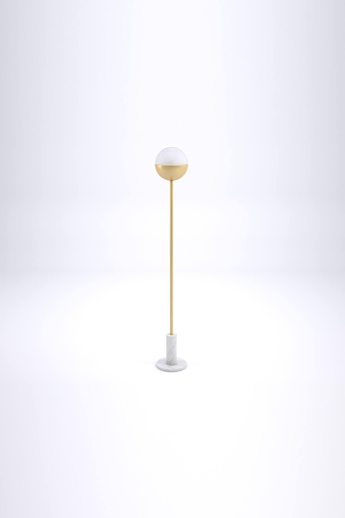 Famed floor lamp by Lagu.
Designed by Ufuk Ceylan.
Dimensions: Ø 26 x H 182 cm.
Materials: Metal, Marble.

While the organic form of the marble and brass combination carries the symbol of the universe to the spaces, Famed Floor Lamp provides