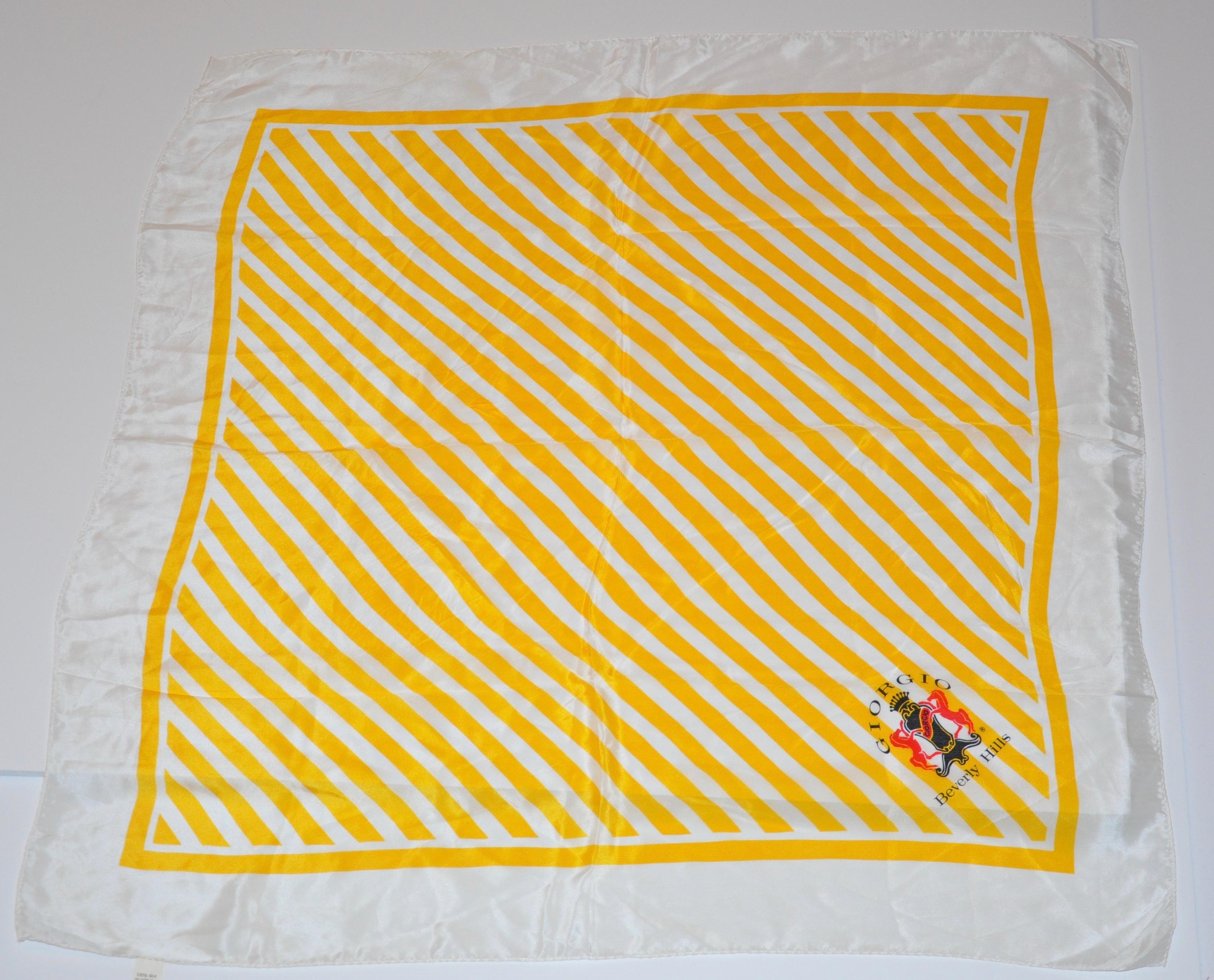        The famed iconic Giorgio of Beverly Hills signature Yellow and Ivory stripes of this silk scarf, which measures 30 inches by 31 inches with rolled edges, combined with a make-up case of cotton canvas on the exterior. The interior has two