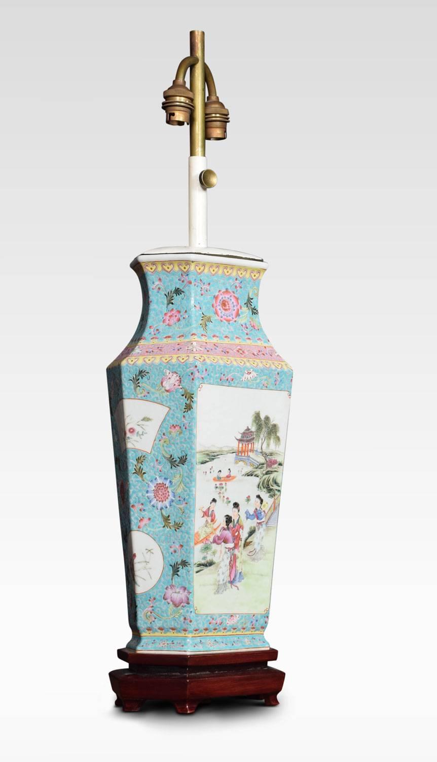 Famille rose Canton porcelain vase lamp, with adjustable stem above. The vase painted with reserves of traditional figures and flower heads within foliate and decorated borders. All raised up on Chinese rosewood base.
Dimensions:

Measures: total
