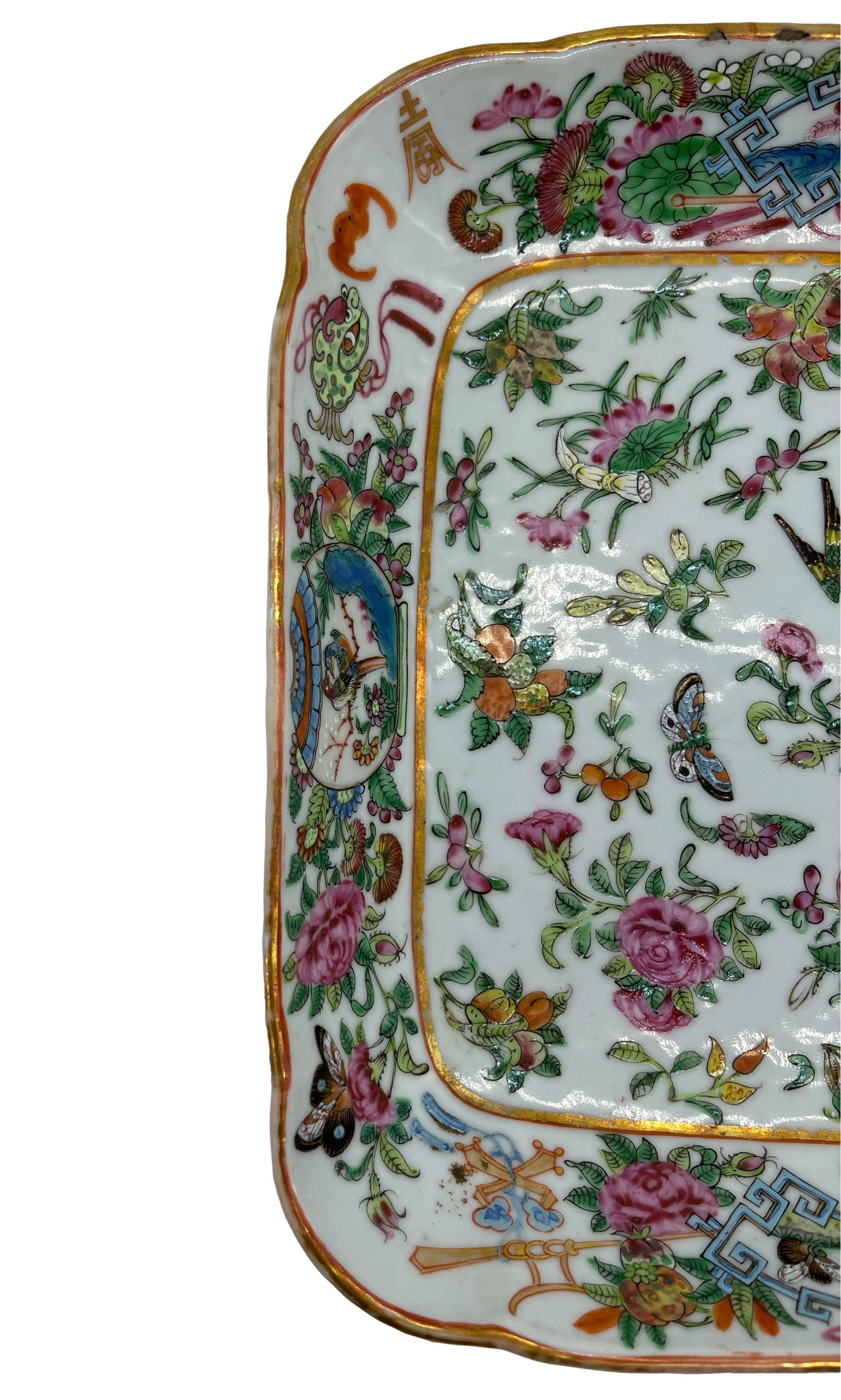 Chinese Export Famille rose square dish, the well profusely decorated with fruit and floral sprays, butterflies, and a single multi-colored and gilded pheasant, the cavetto with a single gilt band, the shaped rim with two opposite panels with a