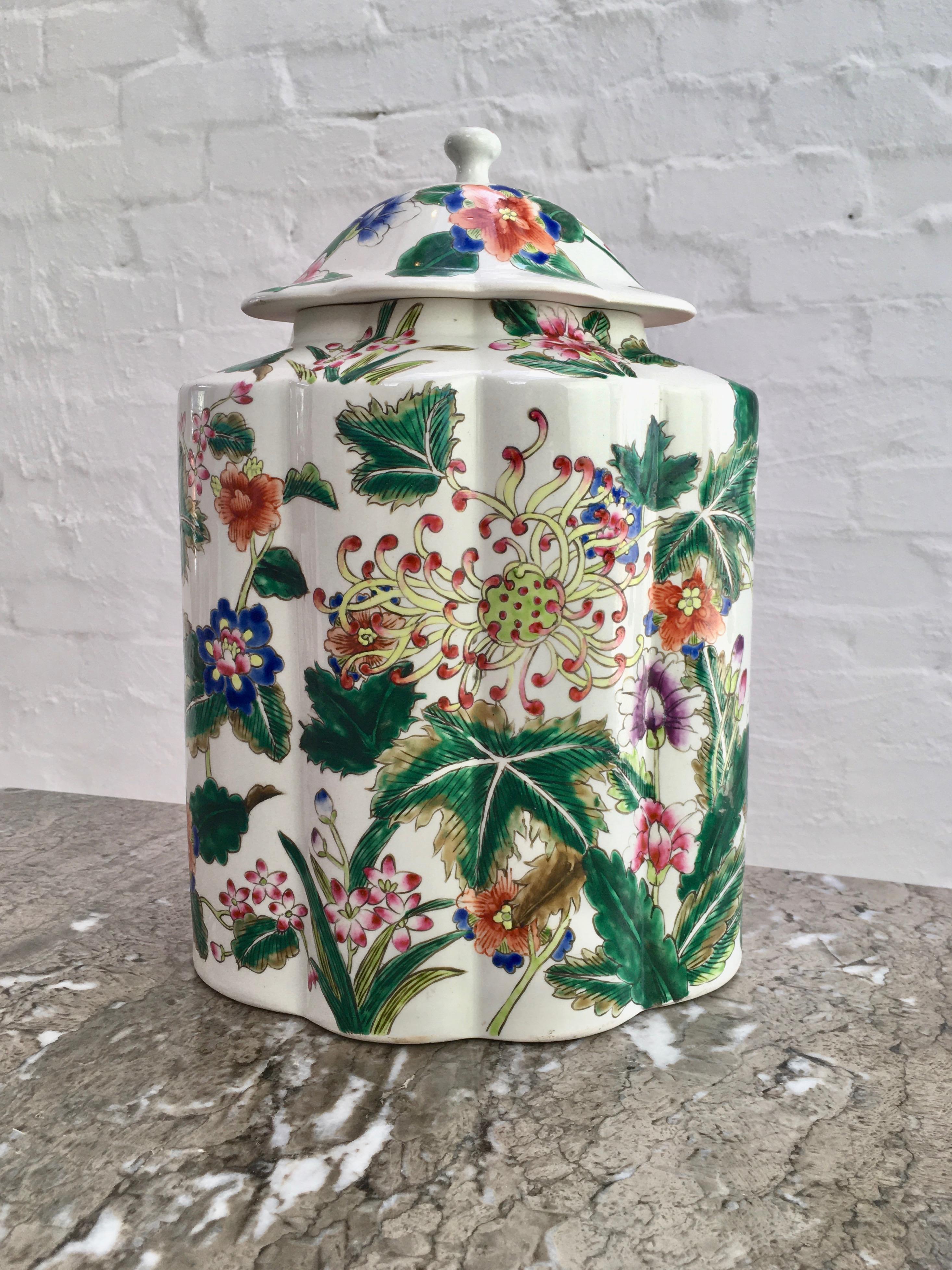 A large polychrome lobed, lidded jar in the Famille Verte Kangxi decorative style. This jar is certainly not 19th Century and possibly not a Chinese production. 

Yet, it is highly decorative in size, shape, floral design and colour, making it a