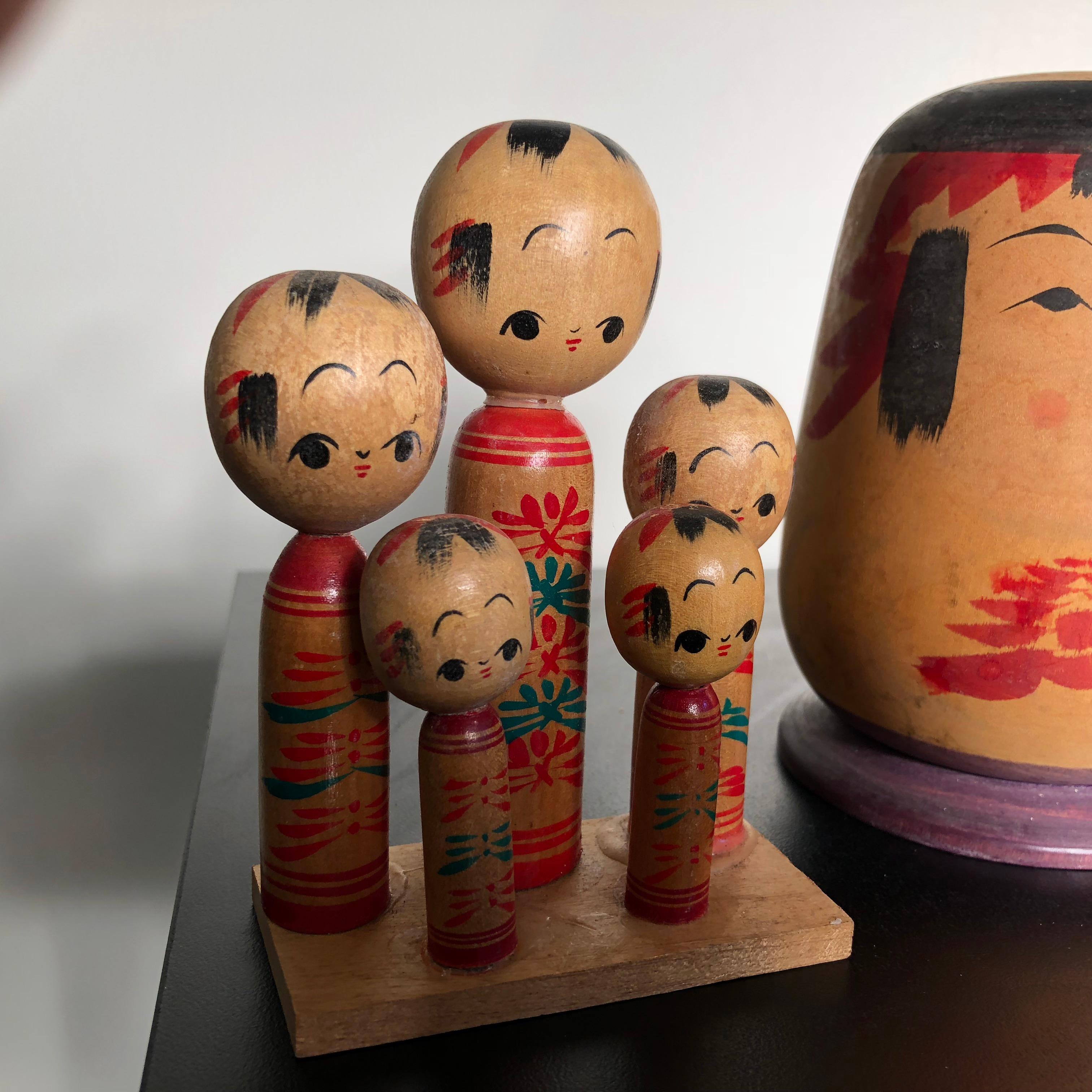 20th Century Family Eight Old Japanese Famous Kokeshi Dolls, All Hand Painted and Signed