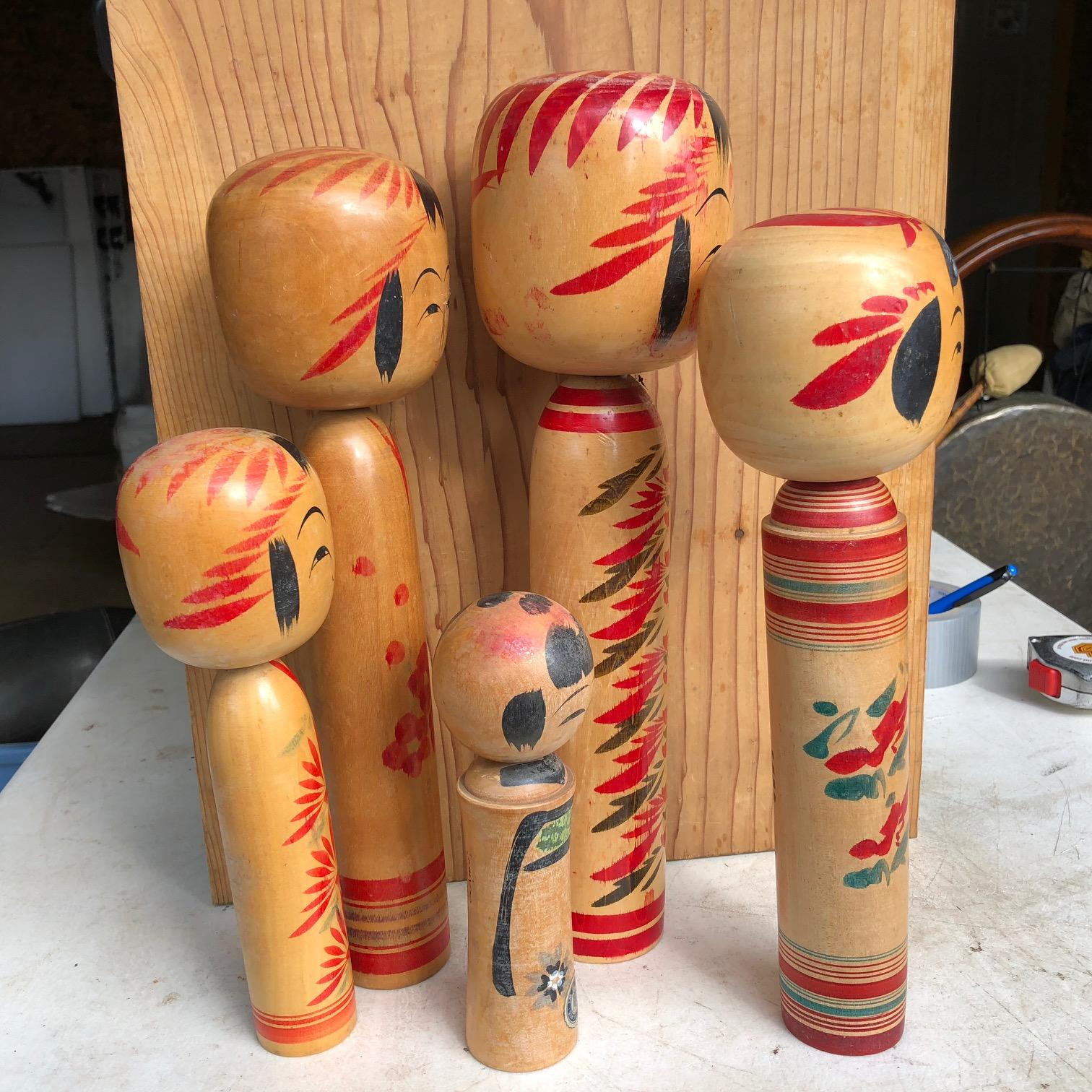 Five hand painted and signed Kokeshi Dolls from Old Japan.

A beautifully preserved five some (5) of Japanese Folk Art hand carved and hand painted Kokeshi dolls one of Japan's most popular antique doll collectibles and unique handicraft forms.