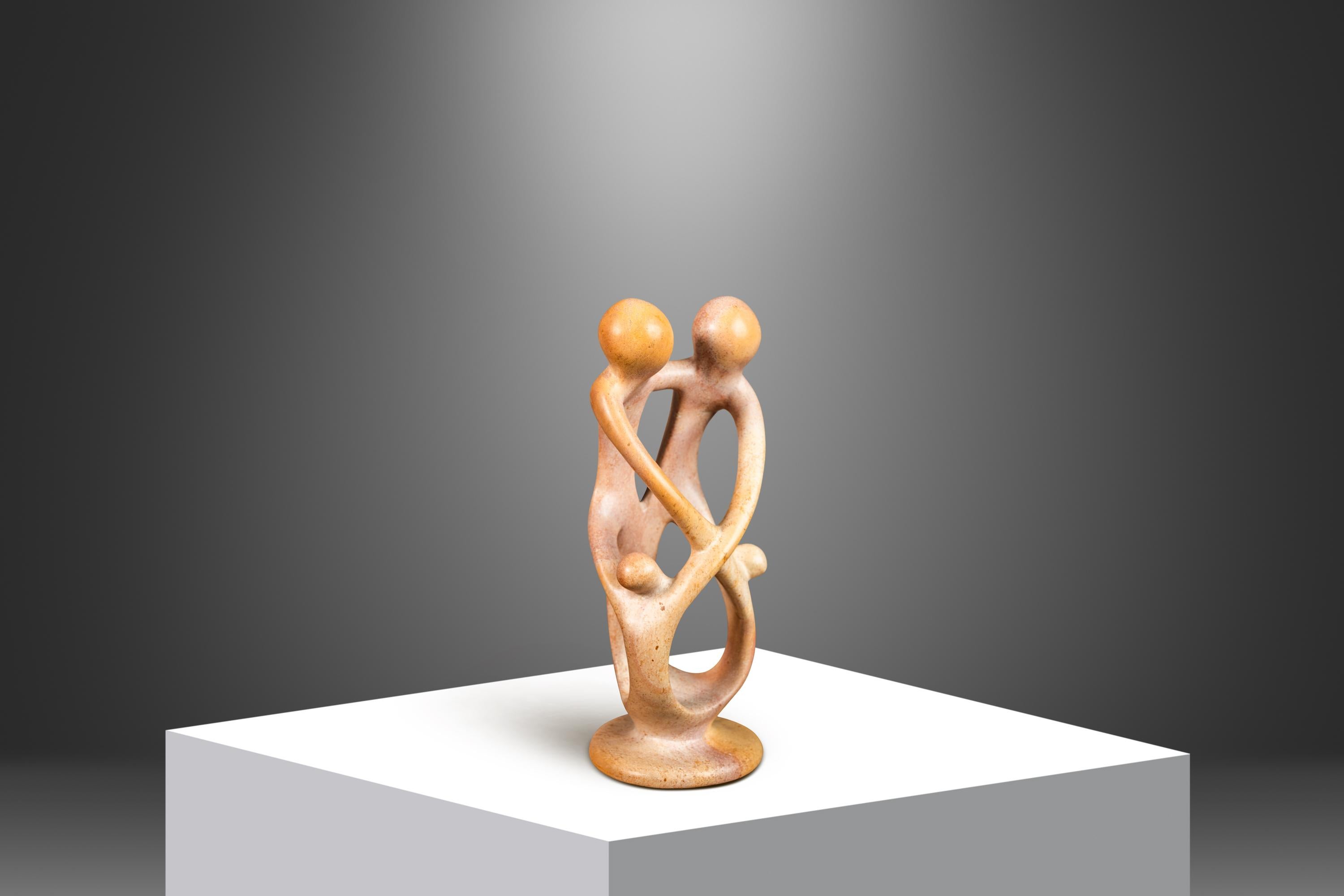 Introducing a heart-warming abstract sculpture depicting parents with a child in embrace. Hand-carved in solid marble by a Kenyan artisan this exquisite, petite sculpture is the perfect gift to new parents or for collectors searching for a unique,