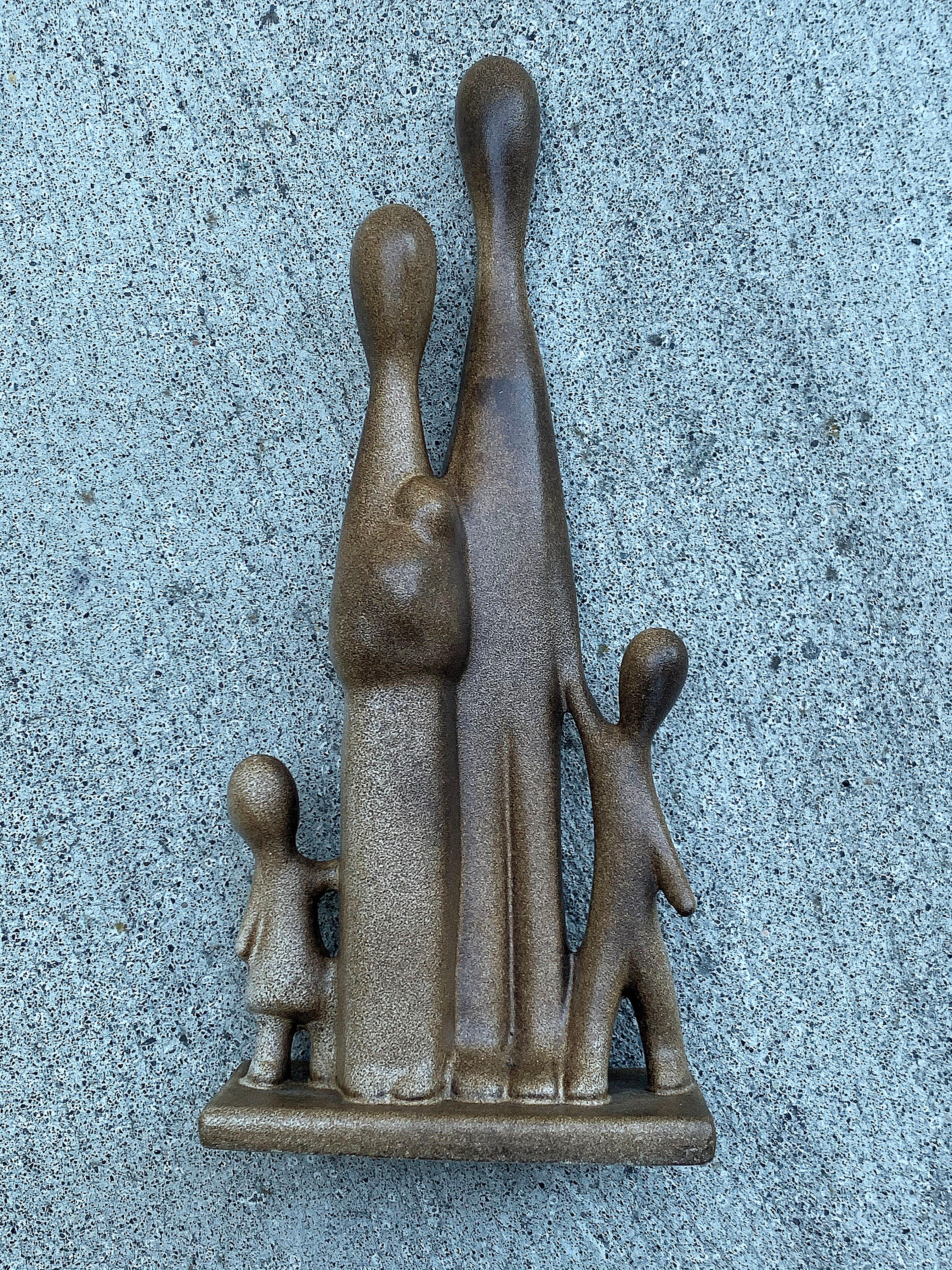 Family of five ceramic sculpture by Howard Pierce. Howard Pierce graduated from the Art Institute of Chicago, later moving to California where he attended Pomona College. Matte brown finish glaze. This piece is stamped with the artist's name at