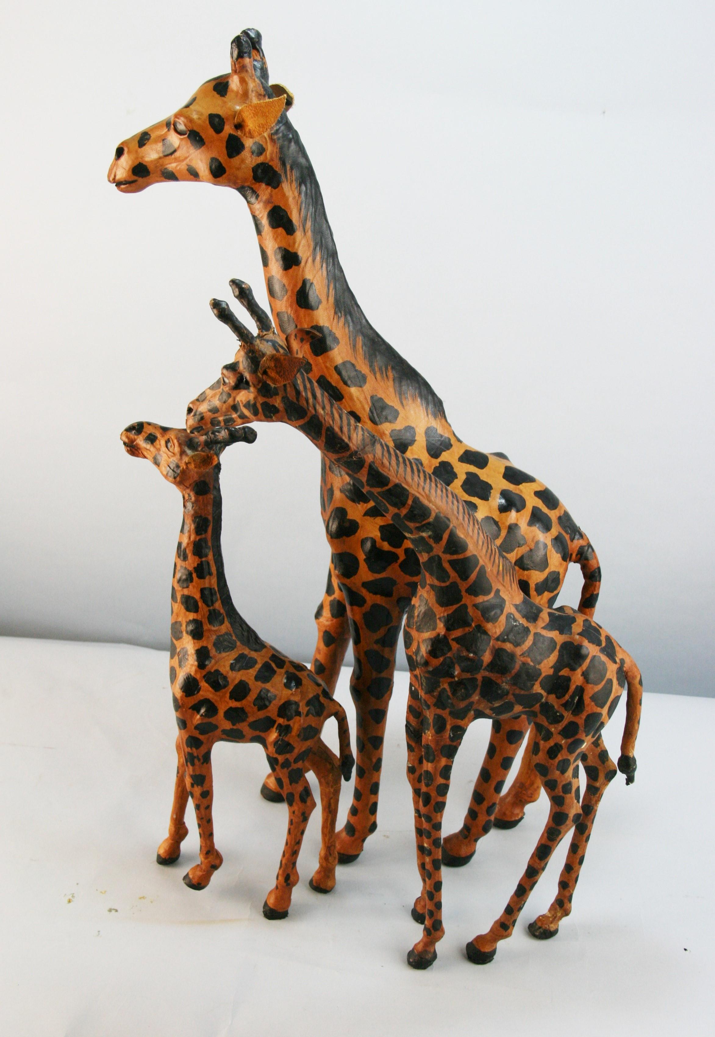 Family of 3 carved wood giraffes covered with hand painted leather
Large 5x15x24