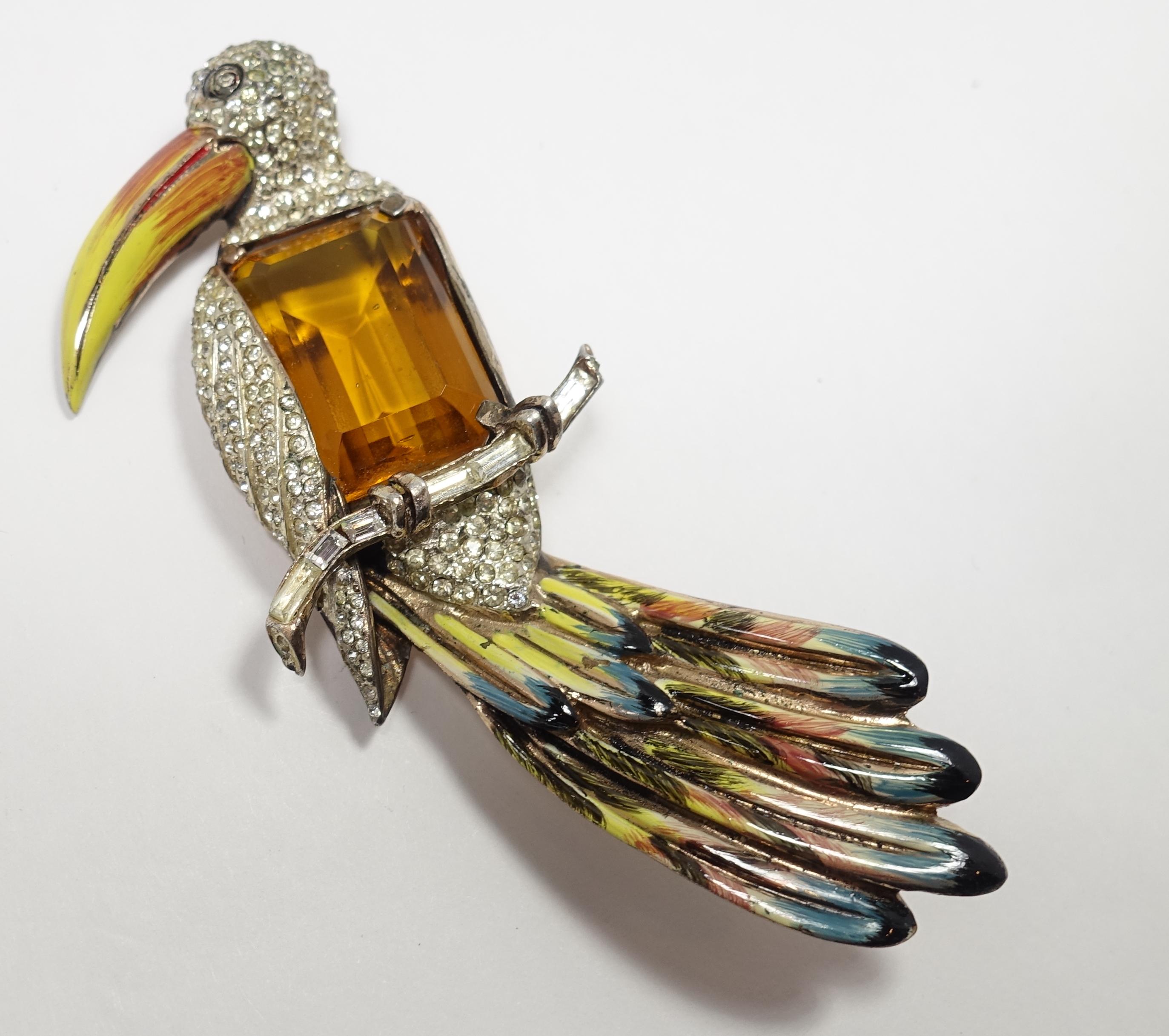 This rare book piece by CoroCraft features a Toucan bird design with a large topaz color center stone, accented by clear rhinestones and multi-colored enameling.  It is sterling silver with gold vermeil. This brooch measures 3-7/8” x 1-1/2” and is