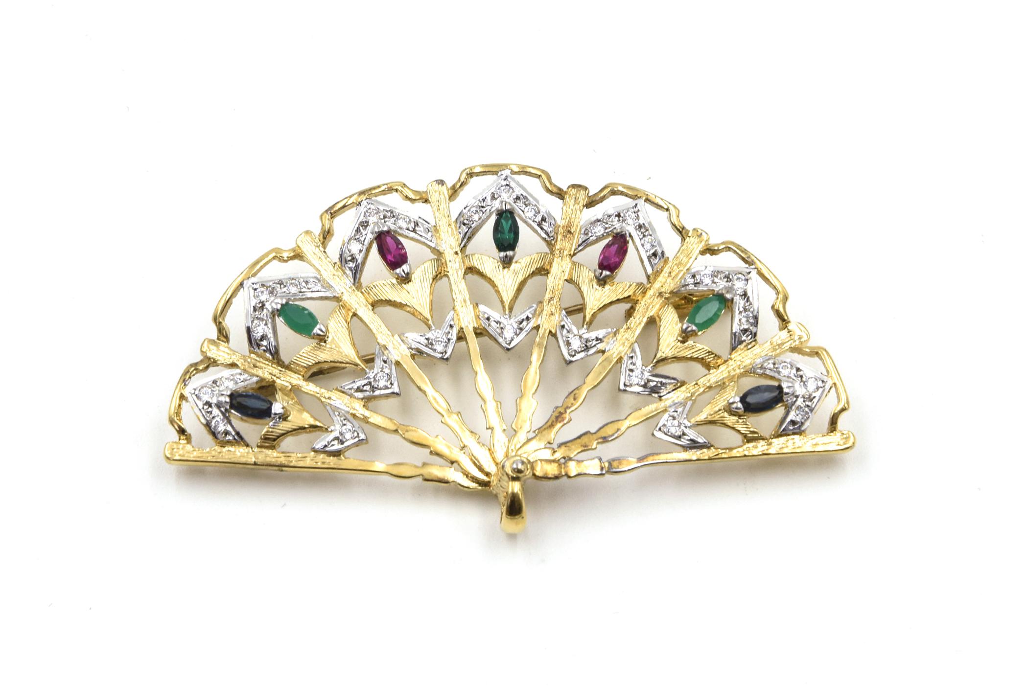 Fabulous Fan Brooch and Earring Set

Looking at them you can just imagine flicking them open - although they do not move. This costume pair of gold tone earrings with a matching brooch contain faux diamonds, emerald, ruby and sapphires.  The