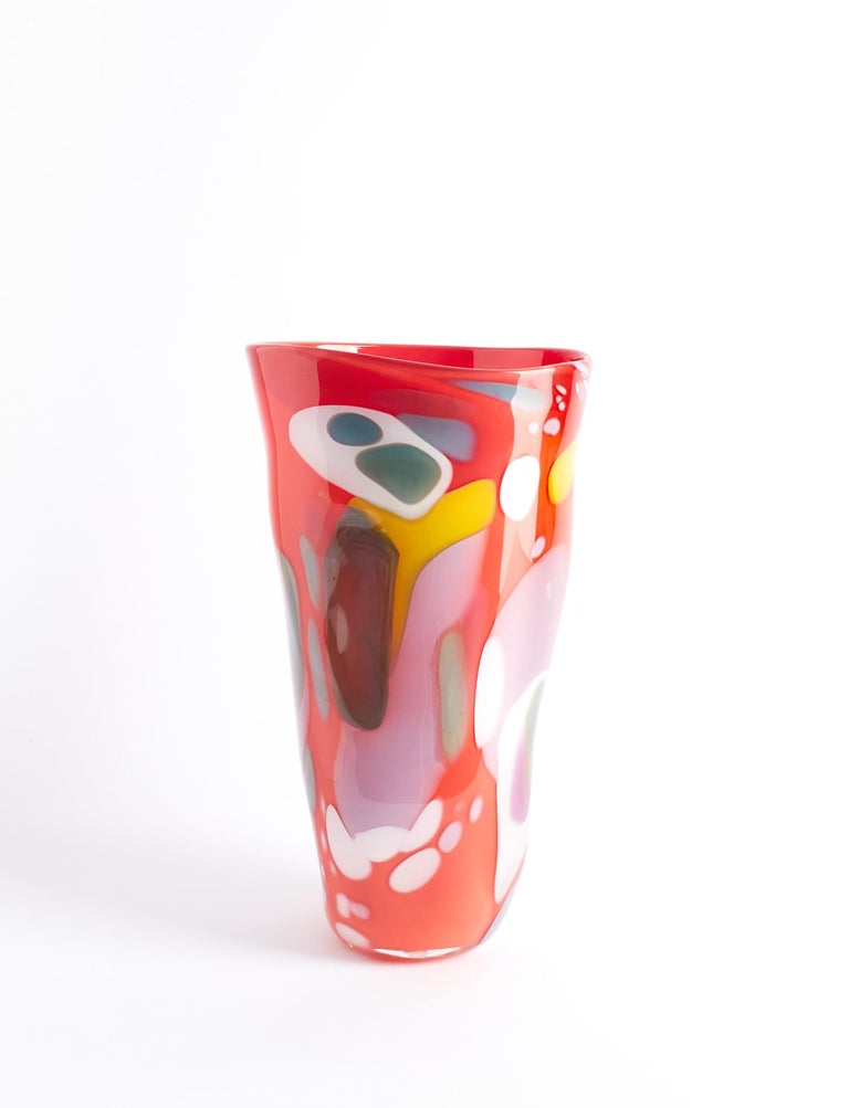 The Epiphany series of vases are as graceful as they are unexpected. The colors swirl, and contrasting hues play off of each other. Each piece has its own personality, each is one of a kind, each like a painting. This vase has a base color of