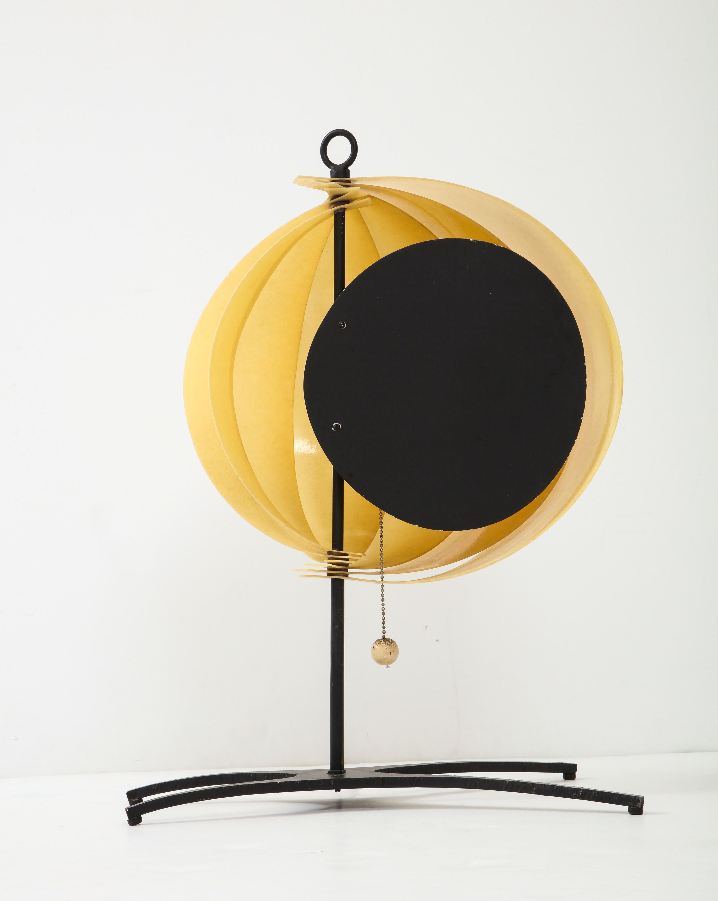 Sculptural desk lamp with adjustable fiberglass fins, cut and enameled aluminum diffuser and base, and a wooden ball pull. Made in 1957 by Jo Mead Designs of Chicago. Jo(sephine) Mead was one of the first female students to attend the Chicago School