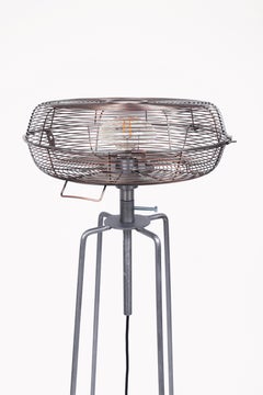 Contemporary upcycled floor lamp made from a reclaimed industrial fan