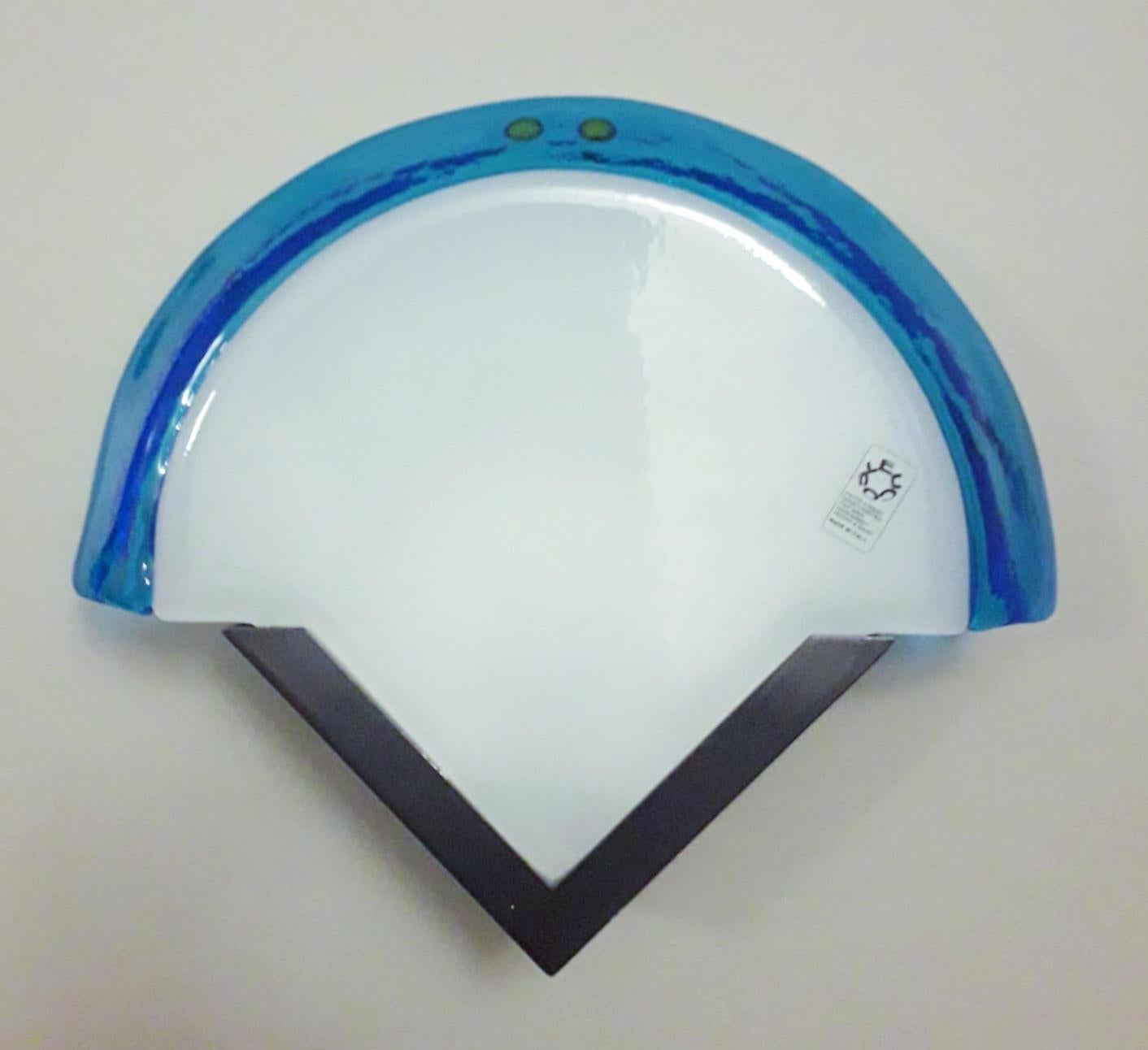 Vintage Italian wall lights with fan shaped blue and white Murano glass shades mounted on metal frames / made in Italy by Leucos, circa 1960s
Original sticker on glass and mark on frame
Measures: height 10.5 inches, width 12.5 inches, depth 3.5