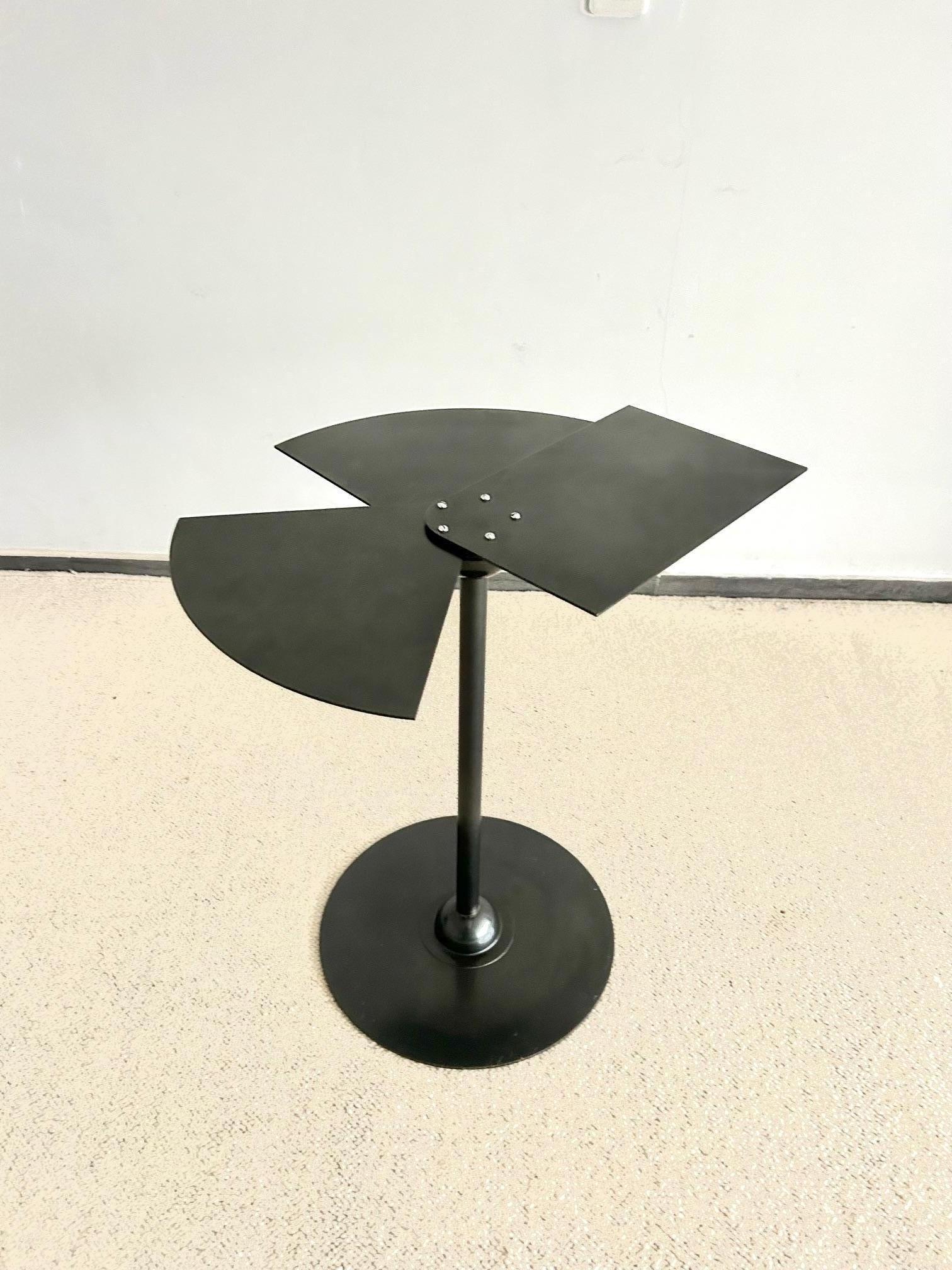 This table is a reissue of the famous model designed by Pierre Chareau in the 1930s. 
This is the first reissue of the 1980s for Ecart Internationnal, during Andrée Putman's life.
It is black/anthracite gray in colour.
Timeless and modernist table.