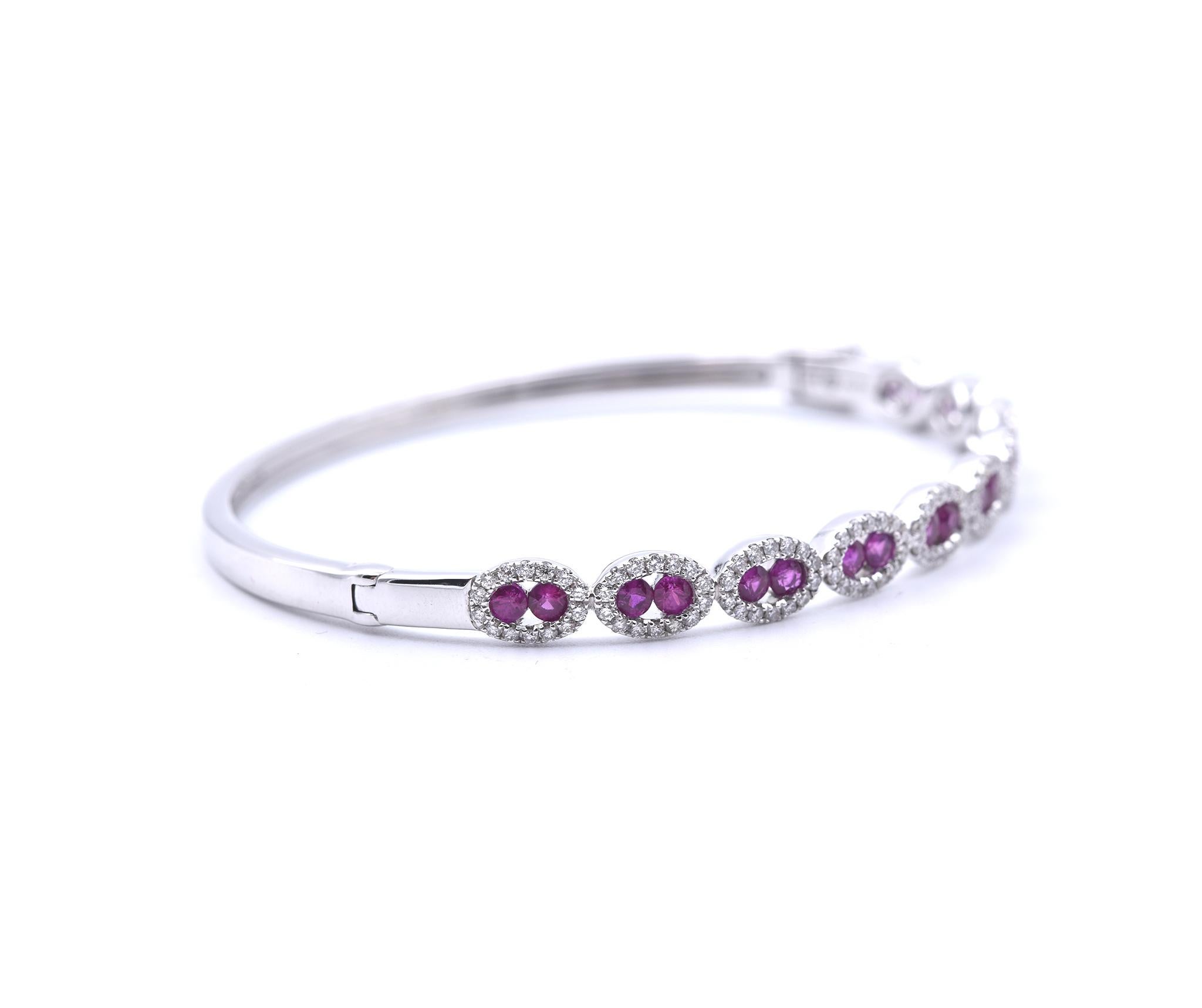 Designer: hallmarked “Fana”
Material: 14k white gold
Rubies: 20 round cut rubies
Diamonds: 140 round brilliant cuts = 0.94cttw
Color: G
Clarity: VS2-SI1
Dimensions: bracelet will fit up to a 7-inch wrist and measures 5.50mm in width
Weight: 14.06