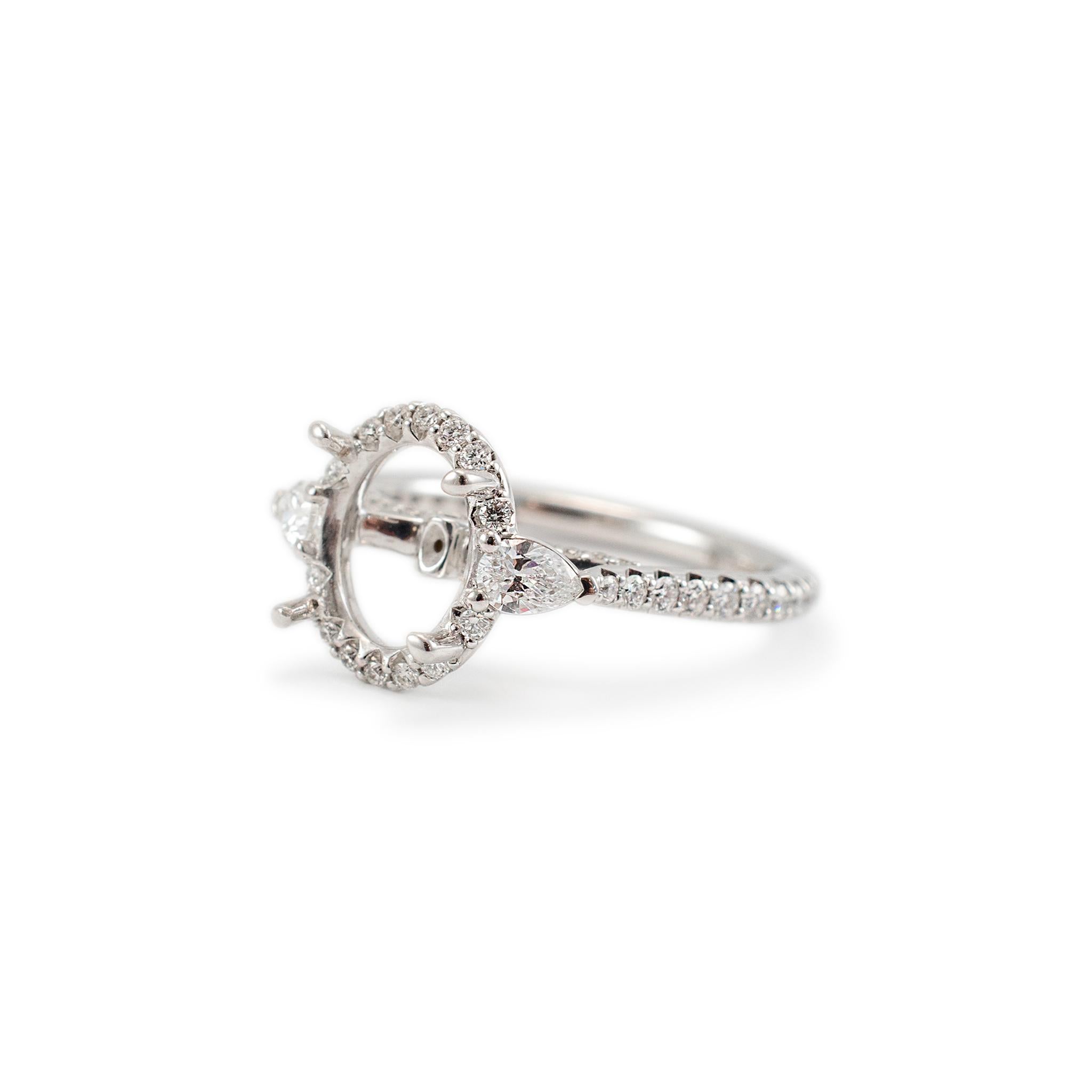 Brand: Fana

Gender: Ladies

Metal Type: 14K White Gold

Ring Size: 6.5

Shank Maximum Width: 2.00 mm

Weight: 3.24 grams

Ladies 14K White Gold diamond three-stone halo accented, semi-mount ring with a half round shank. The metal was tested and