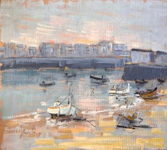 Vintage French Harbour Scene with Moored Boats and Distant Cityscape at Sunset