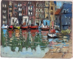 Vibrant Boat Waterfront Scene with Rustic Buildings and Glistening Water