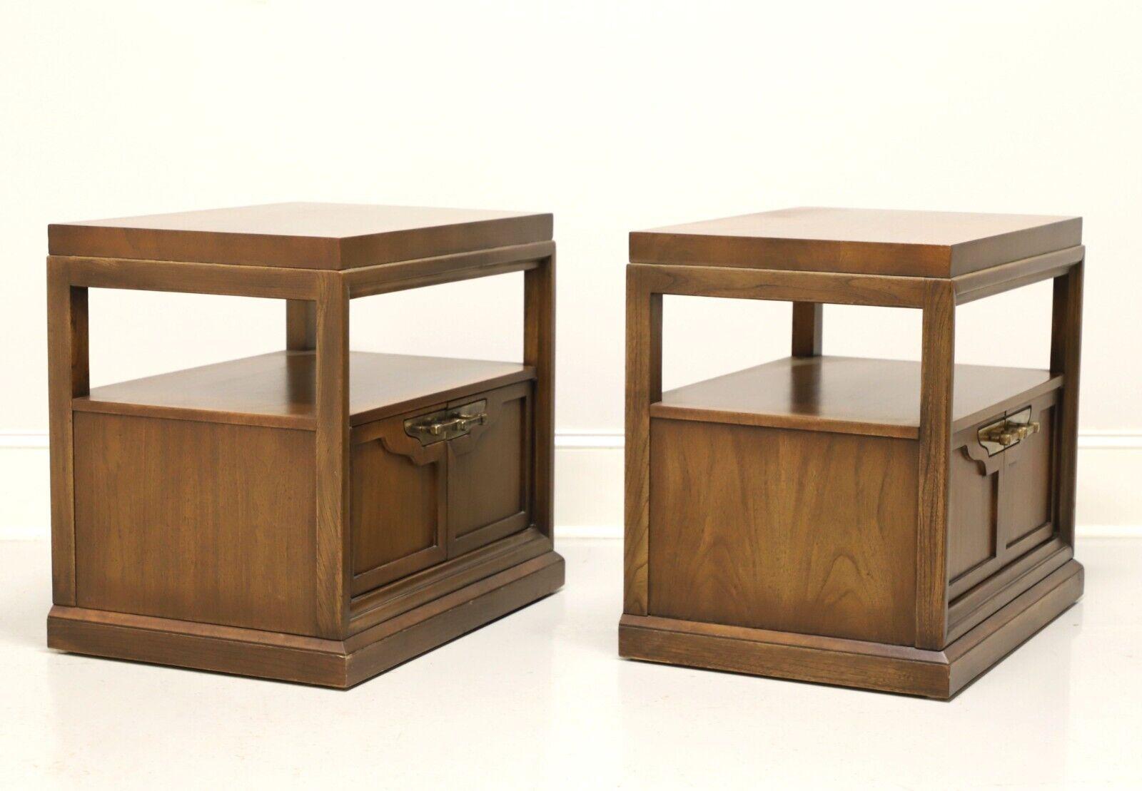 A pair of Neoclassical style nightstands by Fancher Furniture. Walnut with an inlaid  parquetry design to top and brass hardware. Features an one shelf area over a two door cabinet revealing a storage area. Made in Salamanca, New York, USA, circa