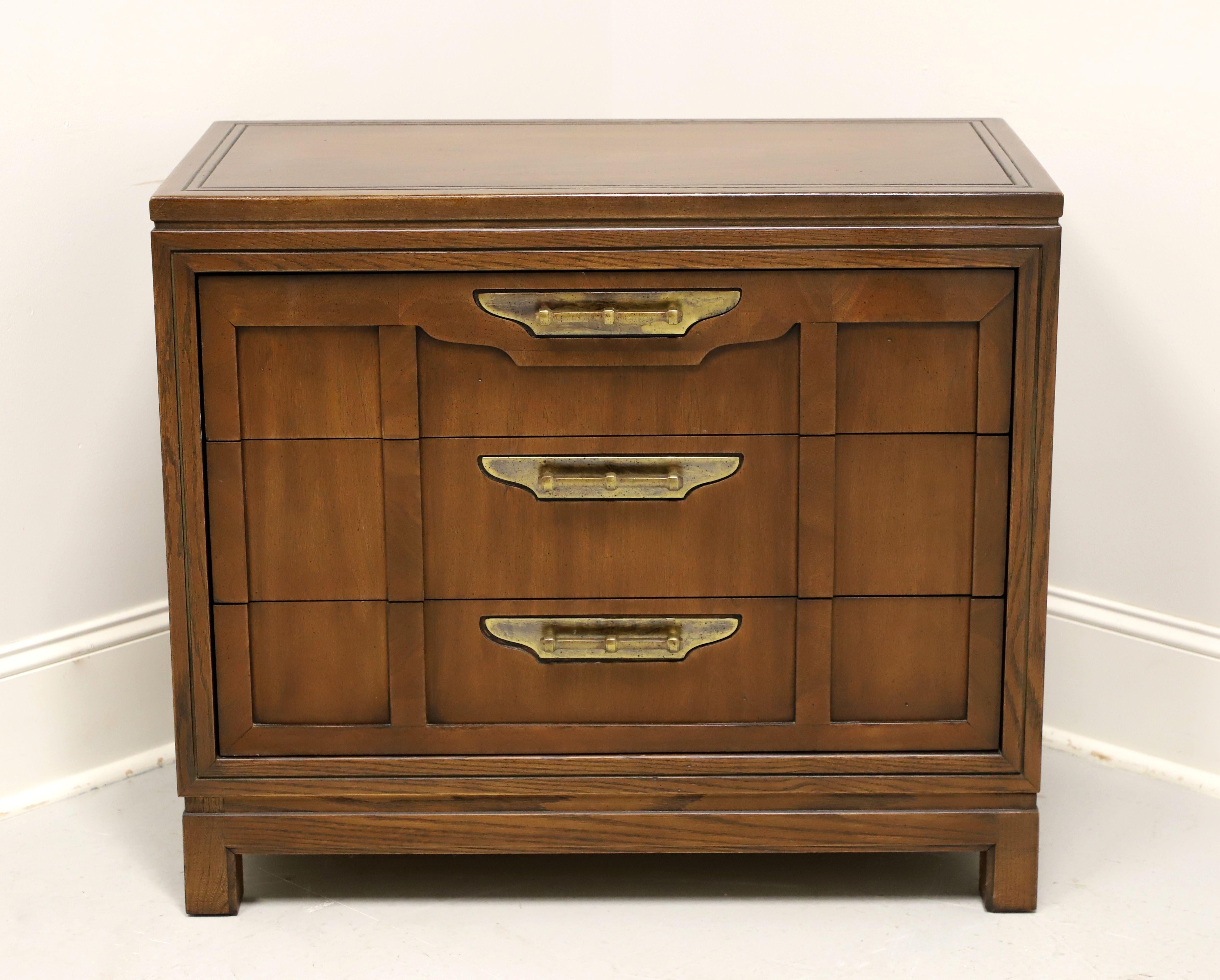 An Asian influenced bachelor chest by Fancher Furniture. Oak with walnut top, drawer fronts & sides, brass hardware, banded top with a solid edge, and block feet. Features three drawers of dovetail construction. Made in Salamanca, New York, USA, in