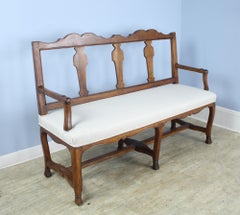 Fancifully Carved Walnut Bench with Hoof Feet