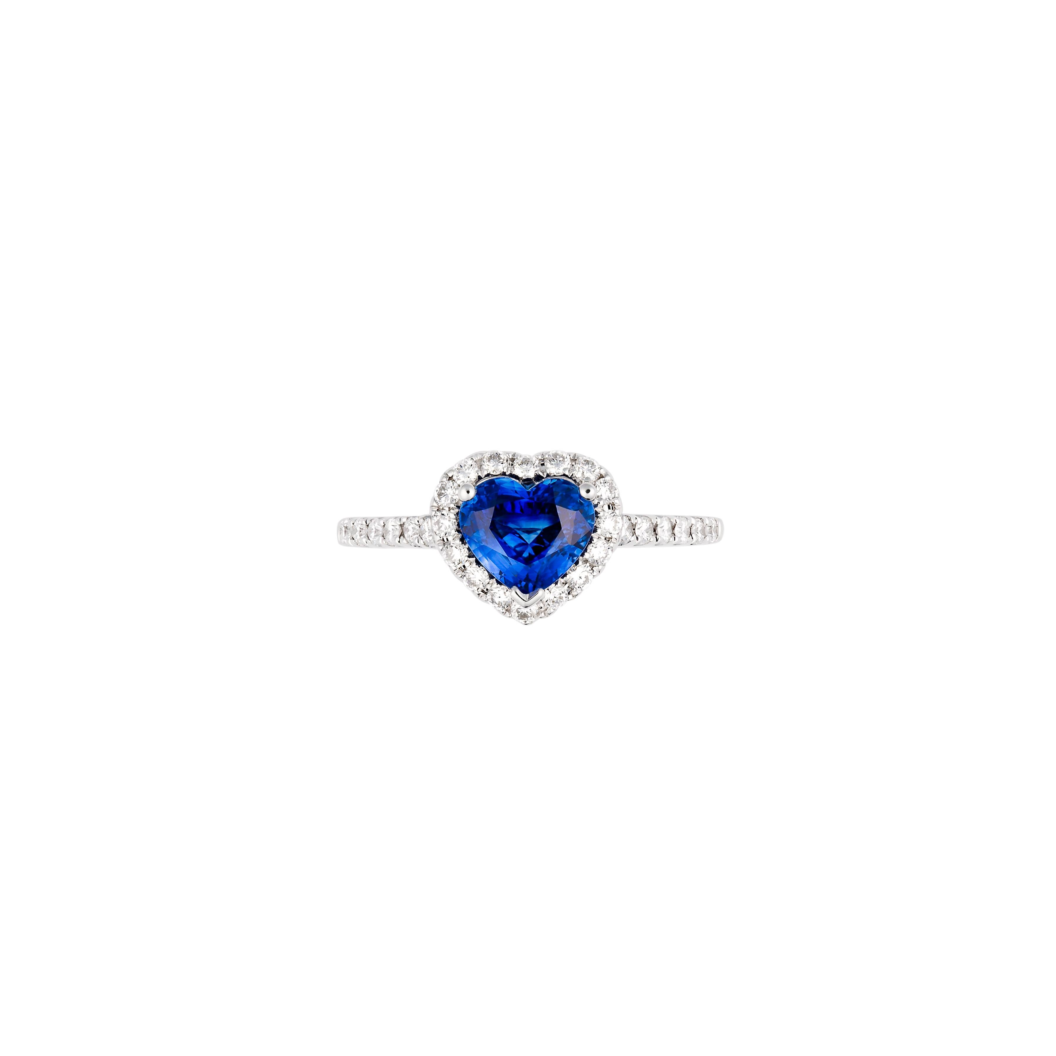 Fancy heart- shaped Kashmir blue Sapphire and diamond ring handcrafted in 18ct white gold. Known as the “Gem of Heaven” this intense velvety -blue colour Kashmir Sapphire has excellent brilliance and has a high level of durability. Cornflower blue