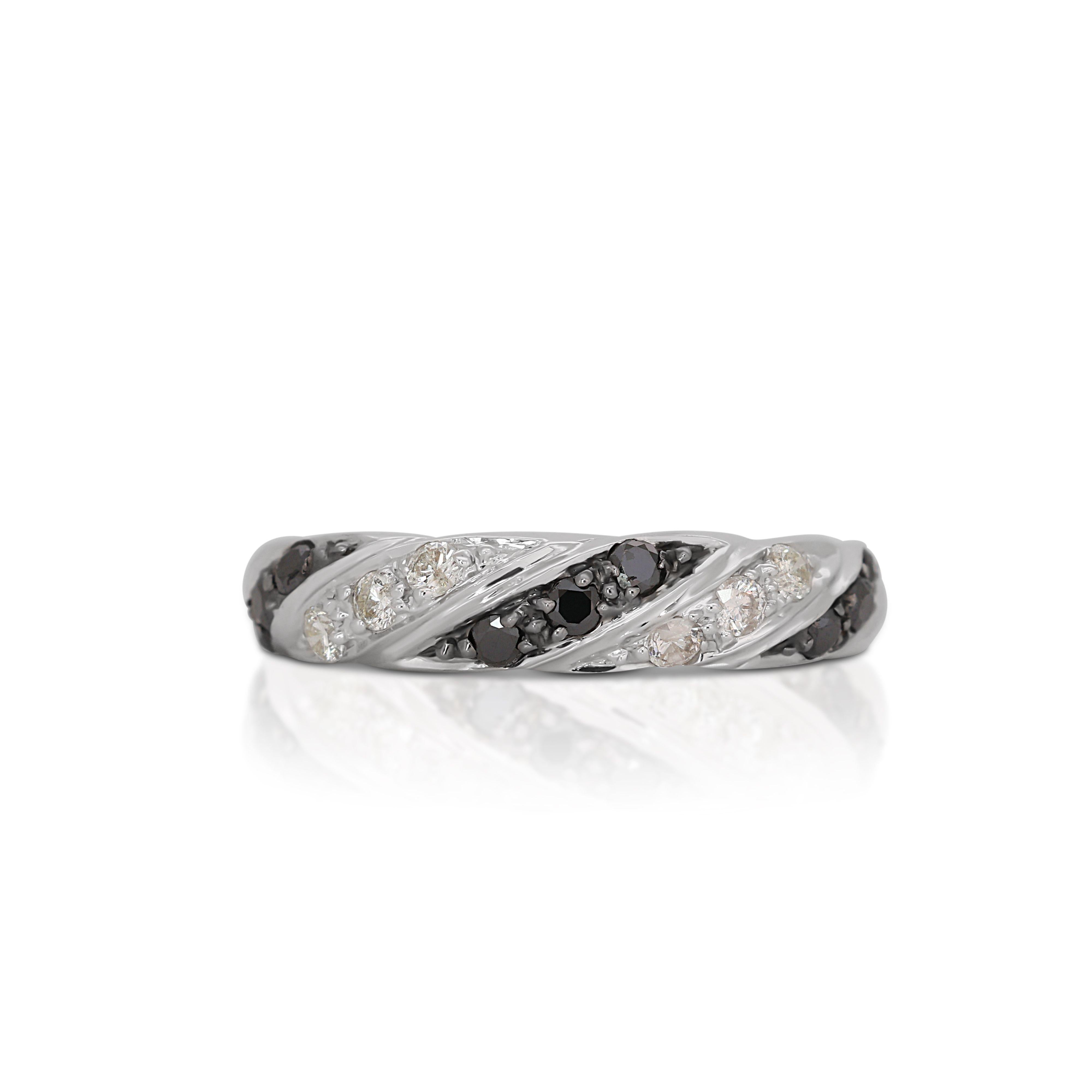 The band of the ring is meticulously crafted, offering a sleek and polished finish that not only enhances the diamond's radiance but also ensures the ring is comfortable to wear. The choice of 18K white gold adds a touch of modernity and luxury to