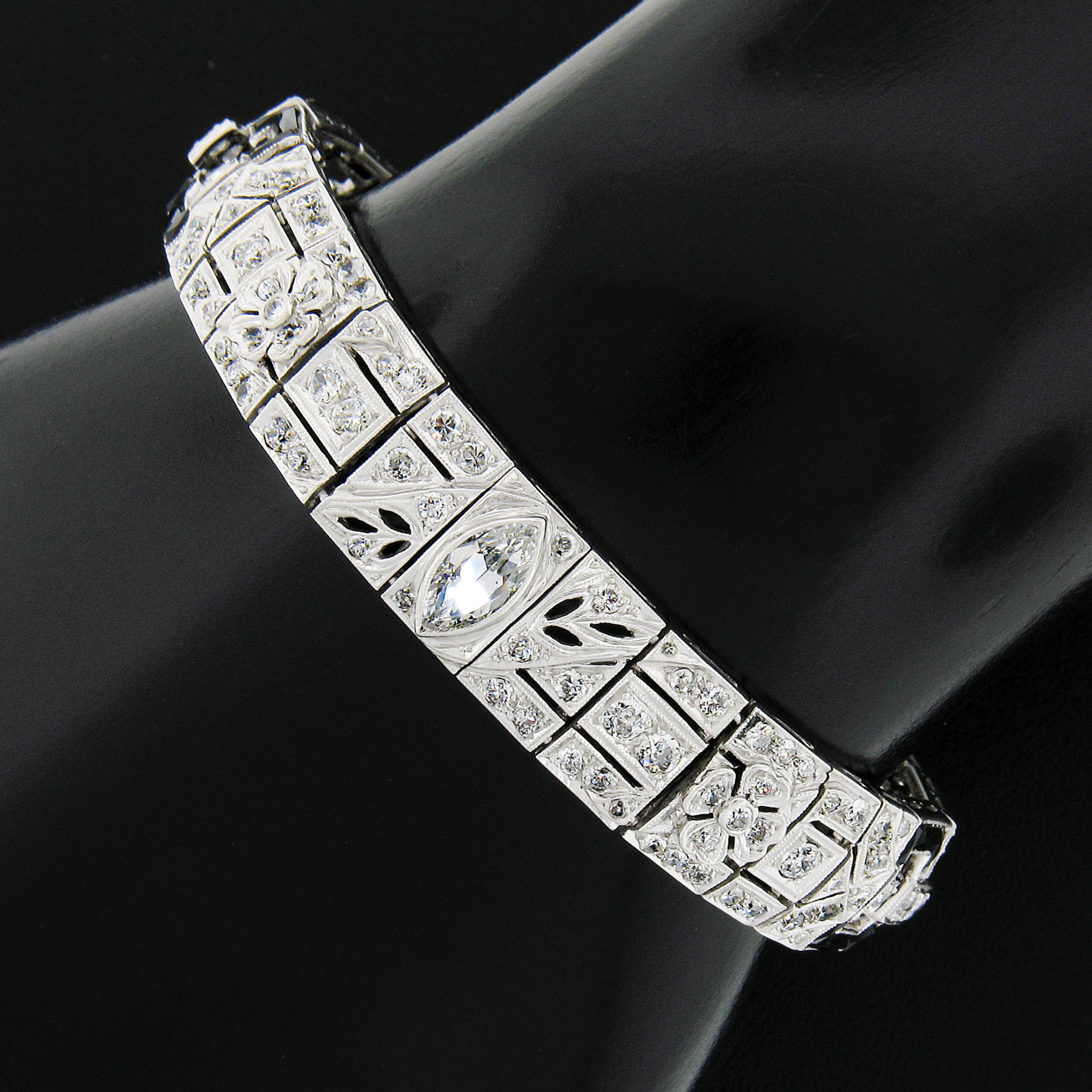 Here we have an absolutely incredible, ALL ORIGINAL, antique art deco period bracelet crafted in solid platinum and features rectangular and square links that are fully and elegantly encrusted with old cut diamonds and French baguette cut black onyx