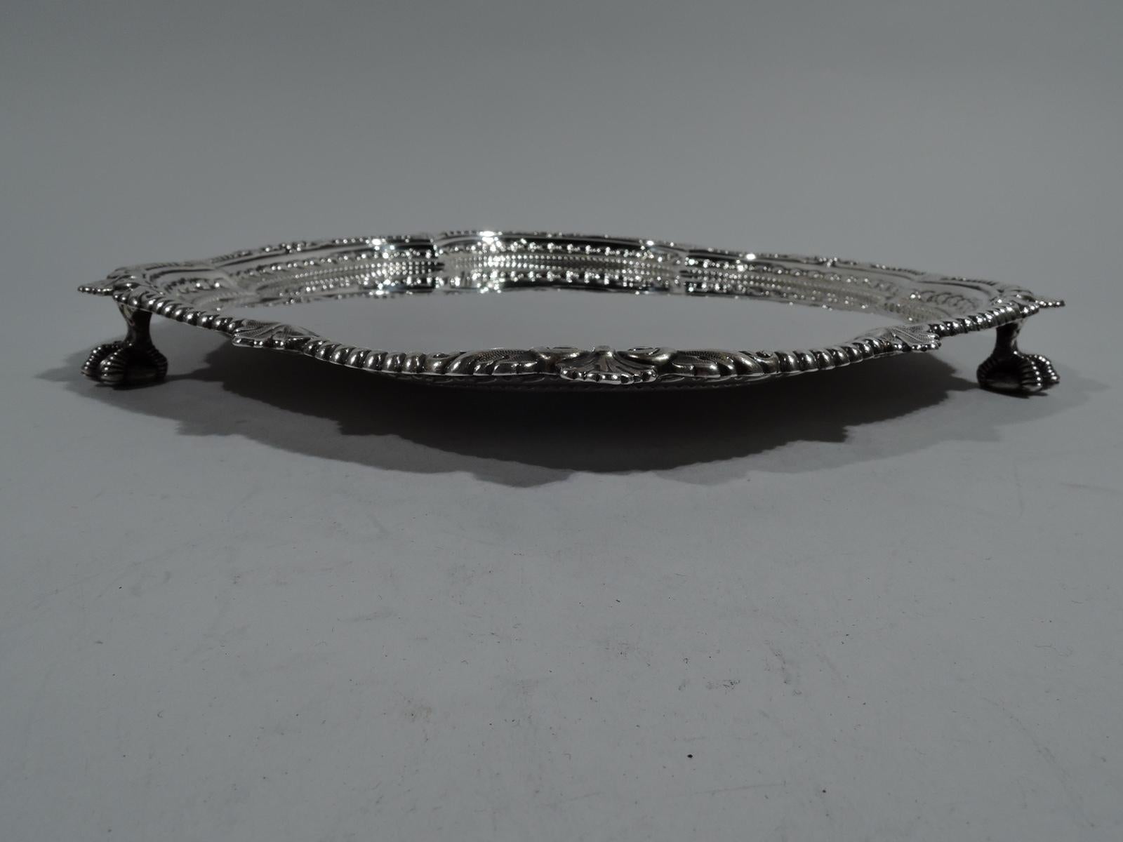 Fancy Victorian Georgian sterling silver salver. Made by Maxfield & Sons in London in 1894. Lobed hexagon with beading and leaves. Rests on 3 claw-and-ball feet. On underside engraved date: Nov. 11, 1896. Fully marked with faint Goldsmiths &