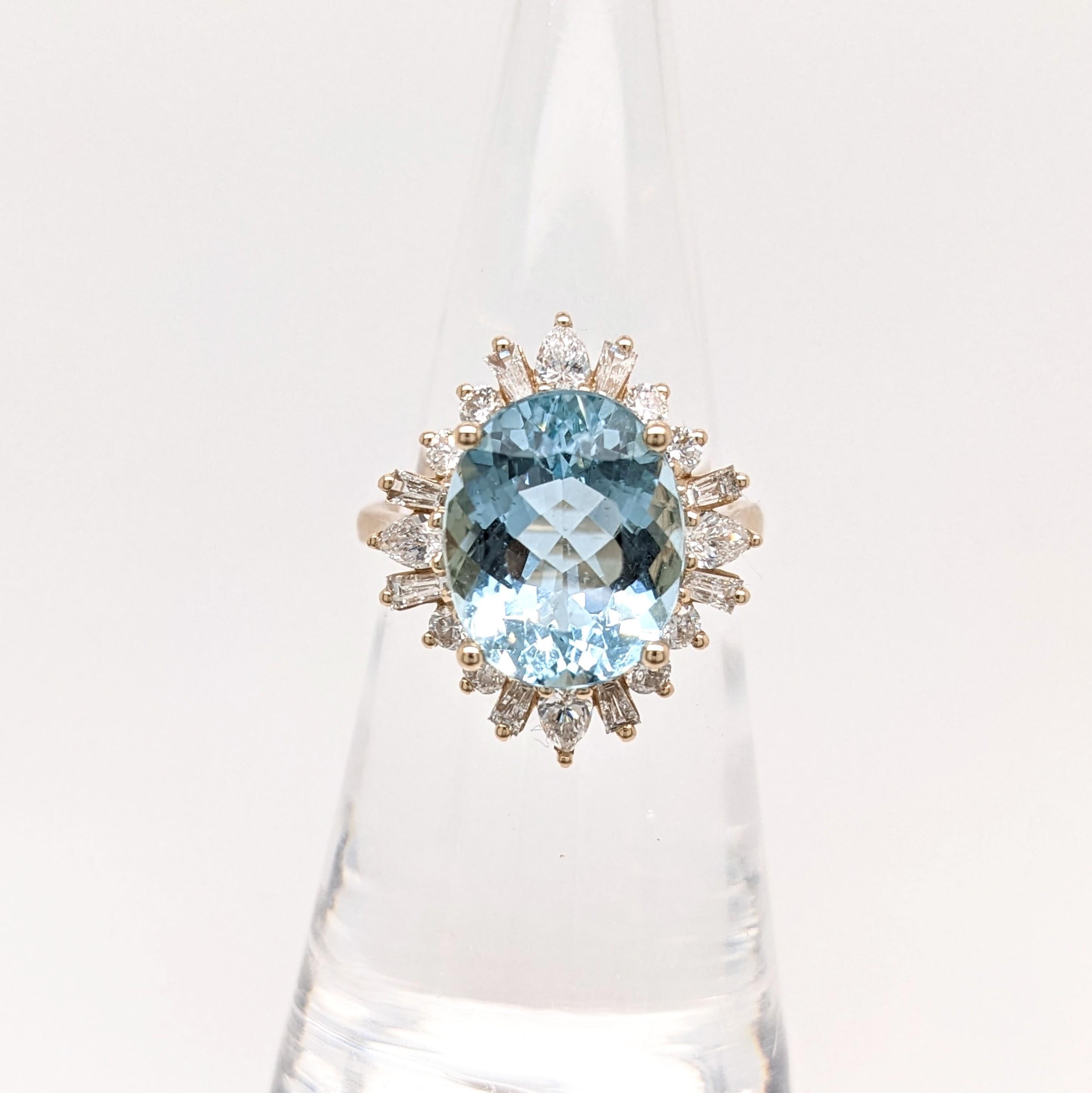 A sparkling blue aquamarine in 14k yellow gold with a fancy all natural earth mined diamond halo. A statement ring design perfect for an eye catching engagement or anniversary.

Specifications

Item Type: Ring
Centre Stone: Aquamarine
Treatment: