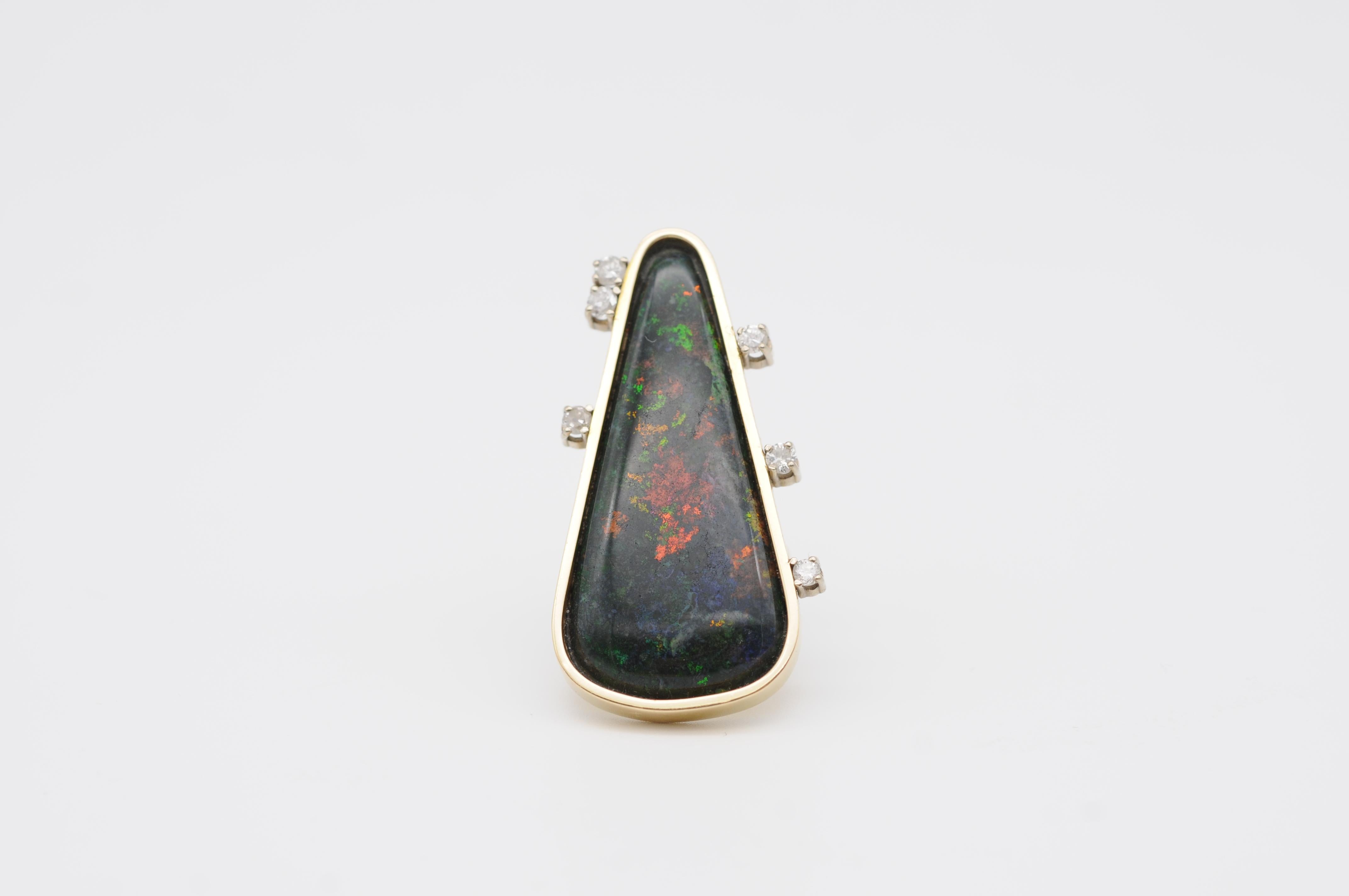 Indulge in the extraordinary beauty and sophistication of the Unusual Australian Black Opal Ring with Brilliants - a one-of-a-kind piece that captures the essence of luxury and elegance. This stunning ring features a large Australian black opal that