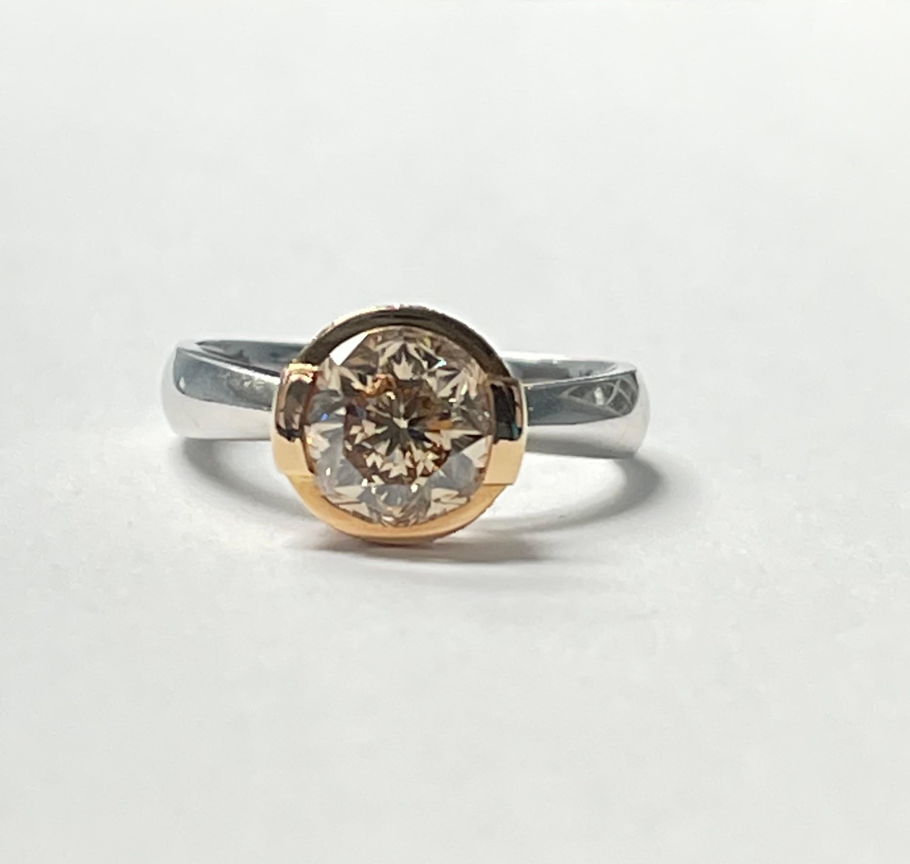 Very pretty fancy brown sunflower cut diamond engagement ring in 18k white and rose gold. 
Diamond weight : 2.26 Carat 
Clarity : VS clarity 
Color : Brown 
Cut : round sunflower cut 
Metal : 18k white and rose gold 
Ring size : 6