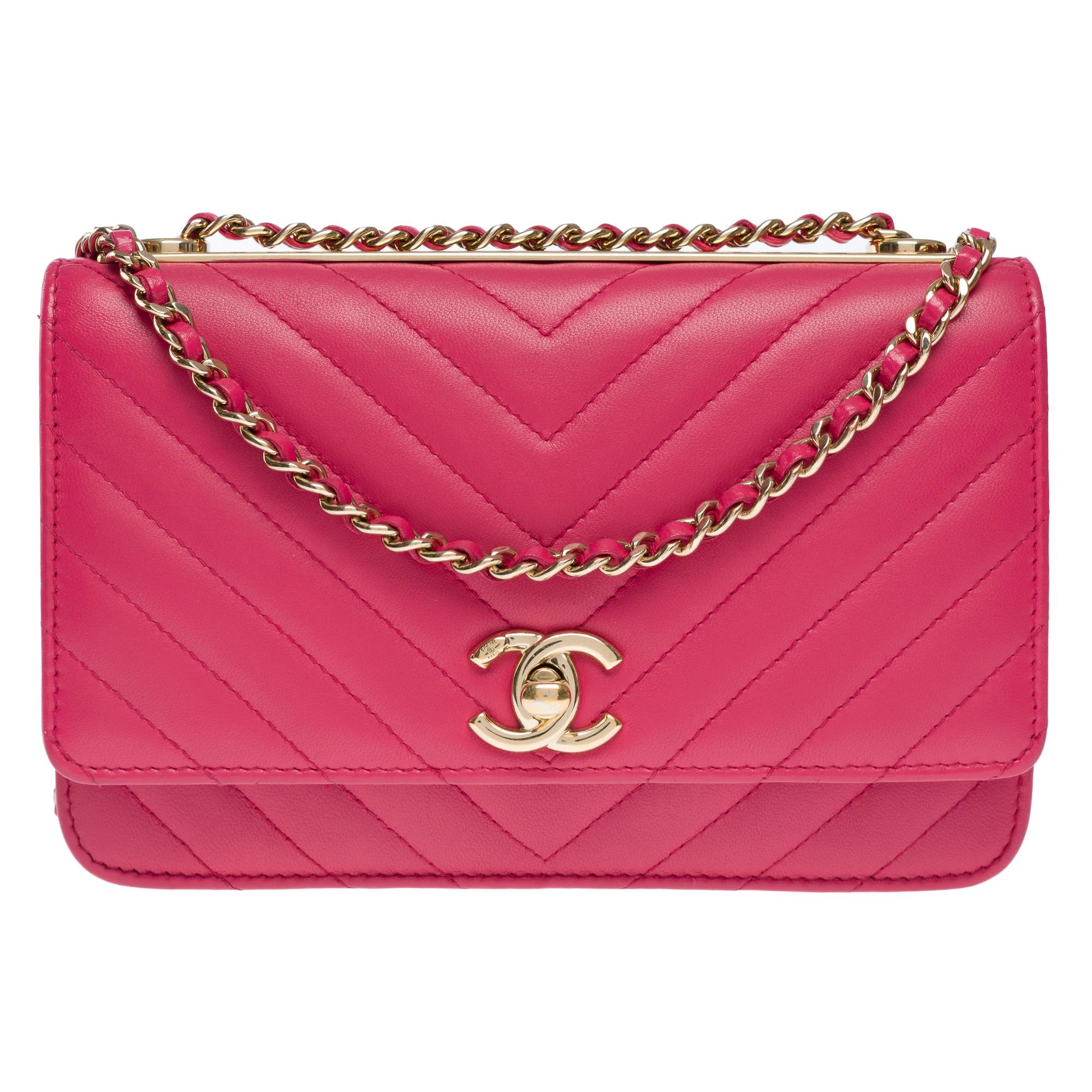 Gorgeous​ ​Chanel​ ​Fancy​ ​Wallet​ ​On​ ​Chain​ ​(WOC)​ ​in​ ​pink​ ​chevron​ ​quilted​ ​lambskin​ ​with​ ​a​ ​gold​ ​Chanel​ ​plate​ ​on​ ​the​ ​top​ ​of​ ​the​ ​bag,​ ​gold​ ​metal​ ​hardware,​ ​a​ ​chain​ ​gold​ ​strap,​ ​can​ ​be​ ​doubled,​