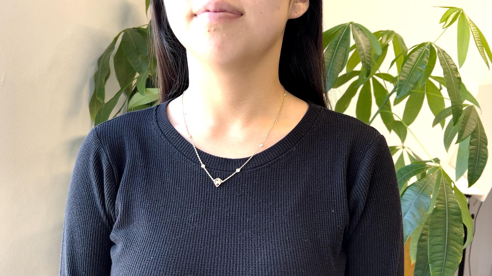 One Fancy Color Diamond 14k Yellow Gold Diamonds By the Yard Chain Necklace. Featuring one GIA kite cut diamond of 1.59 carats, accompanied with GIA #2221837300 stating the diamond is fancy dark brown, VS2 clarity. Accented by ten round brilliant