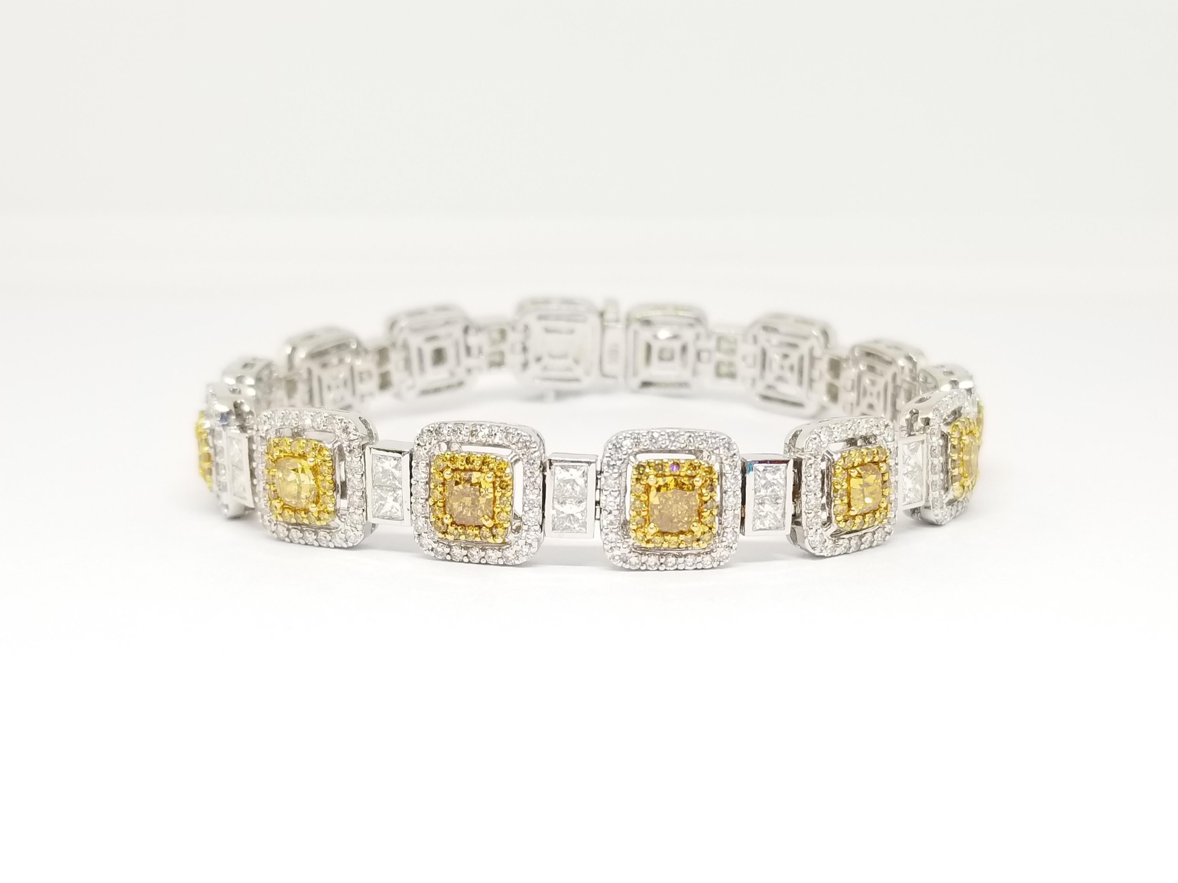 Stunning looking 14 pieces fancy shape colored diamonds bracelet. Perfectly matched fancy colored diamonds and multi-shaped white diamonds. Set in a gorgeous white gold and beautiful cut diamonds. Sparkle with intense fire and brilliance. 7 inch