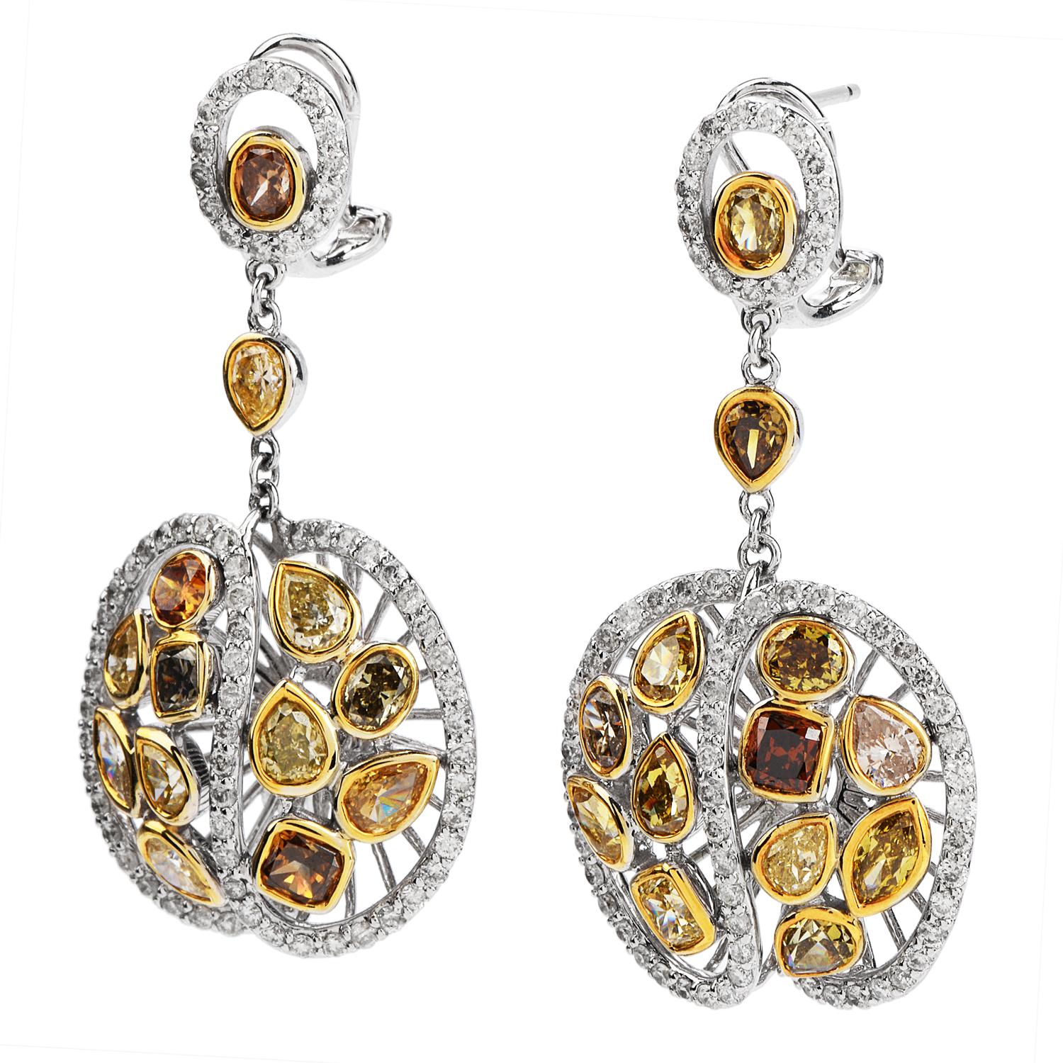 These romantic earrings have circle motifs and swirling flower designs throughout. They are crafted in 14 karat yellow and white gold.

 Set with approximately 22 genuine fancy color diamond with various shape from yellow green to deep orange,