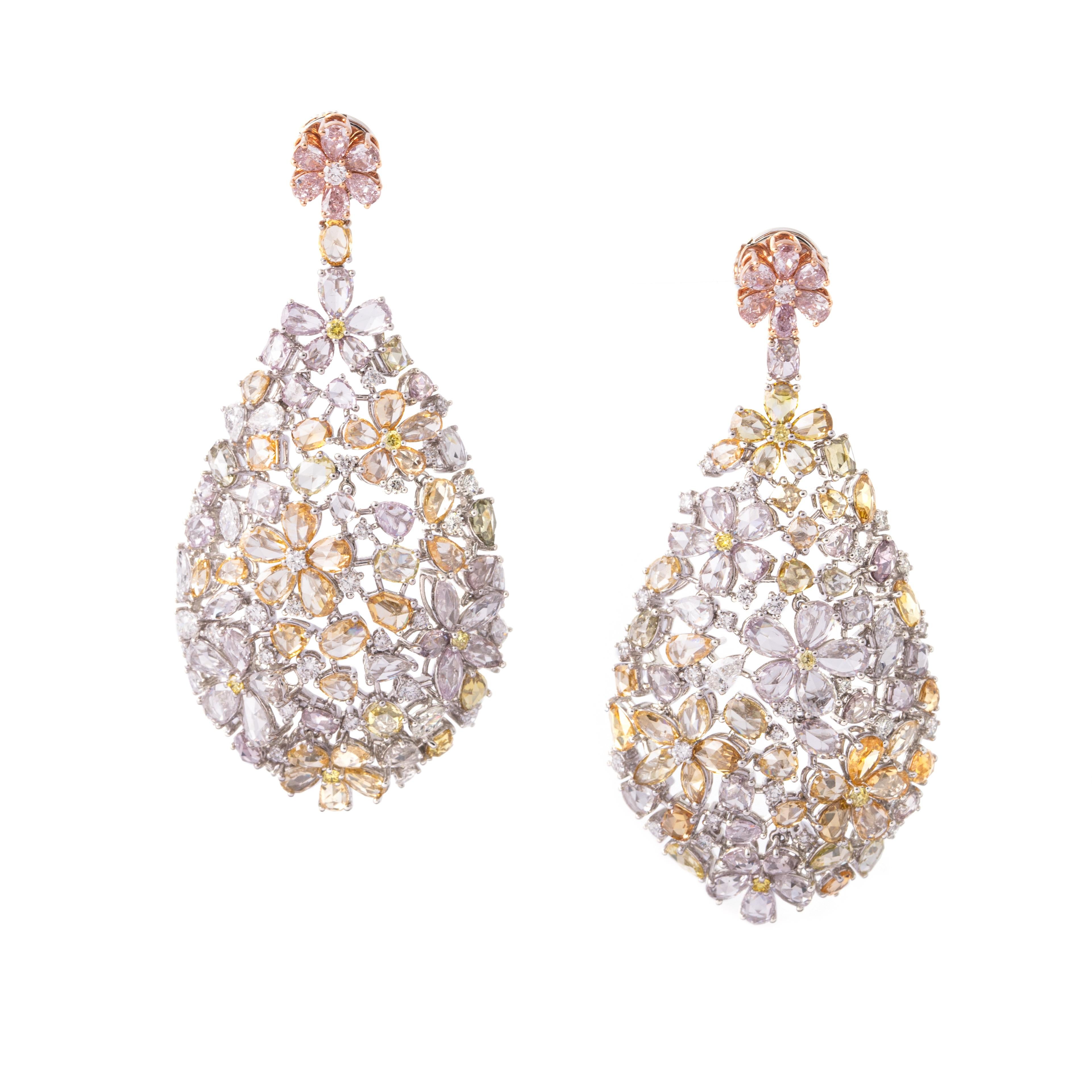 Fancy Color Diamond Flower 18K Gold Earrings.

Natural 148 pieces, 14.23 carats VS-F.
Natural yellow diamonds, round 10 pieces, 0.17 carats, VS.
Natuarl pear 6 pieces, 0.443 carats, VS-F.
Natural marquise 4 pieces, 0.211 carats, VS-F.
Natural round