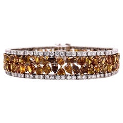 Fancy Color Natural Diamond Statement Bracelet with White Diamond Boarder