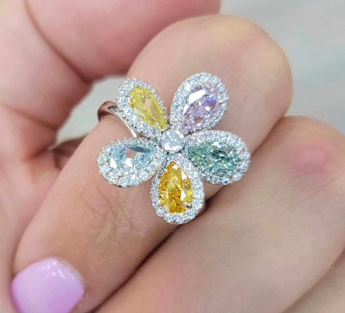 Original Namdar Diamonds piece designed and curated by Daniel Namdar; an exquisite compilation of earths treasures in one beautiful flower ring
All natural GIA certified multi colored Pear shapes set in Platinum with half a carat of white round