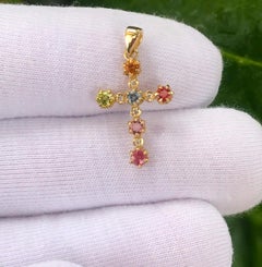 Multicolor gemstones cross pendant in 14k gold