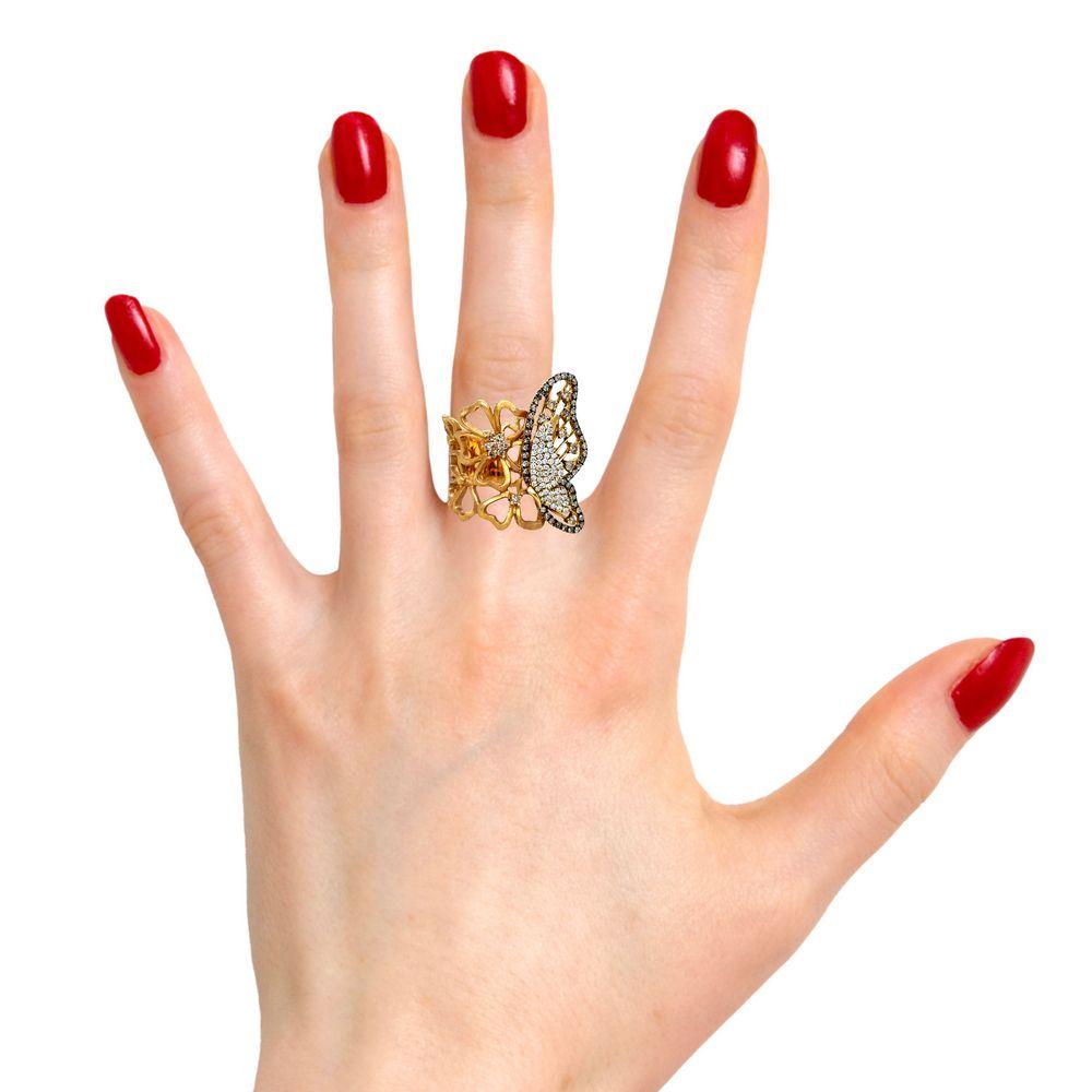 This gorgeous Butterfly ring is perfect to wear to that special event. There are fancy champagne, black and white brilliant cut diamonds all over the butterfly design for a beatiful accent. The band has rows of flowers in 18K Rose Gold. This ring