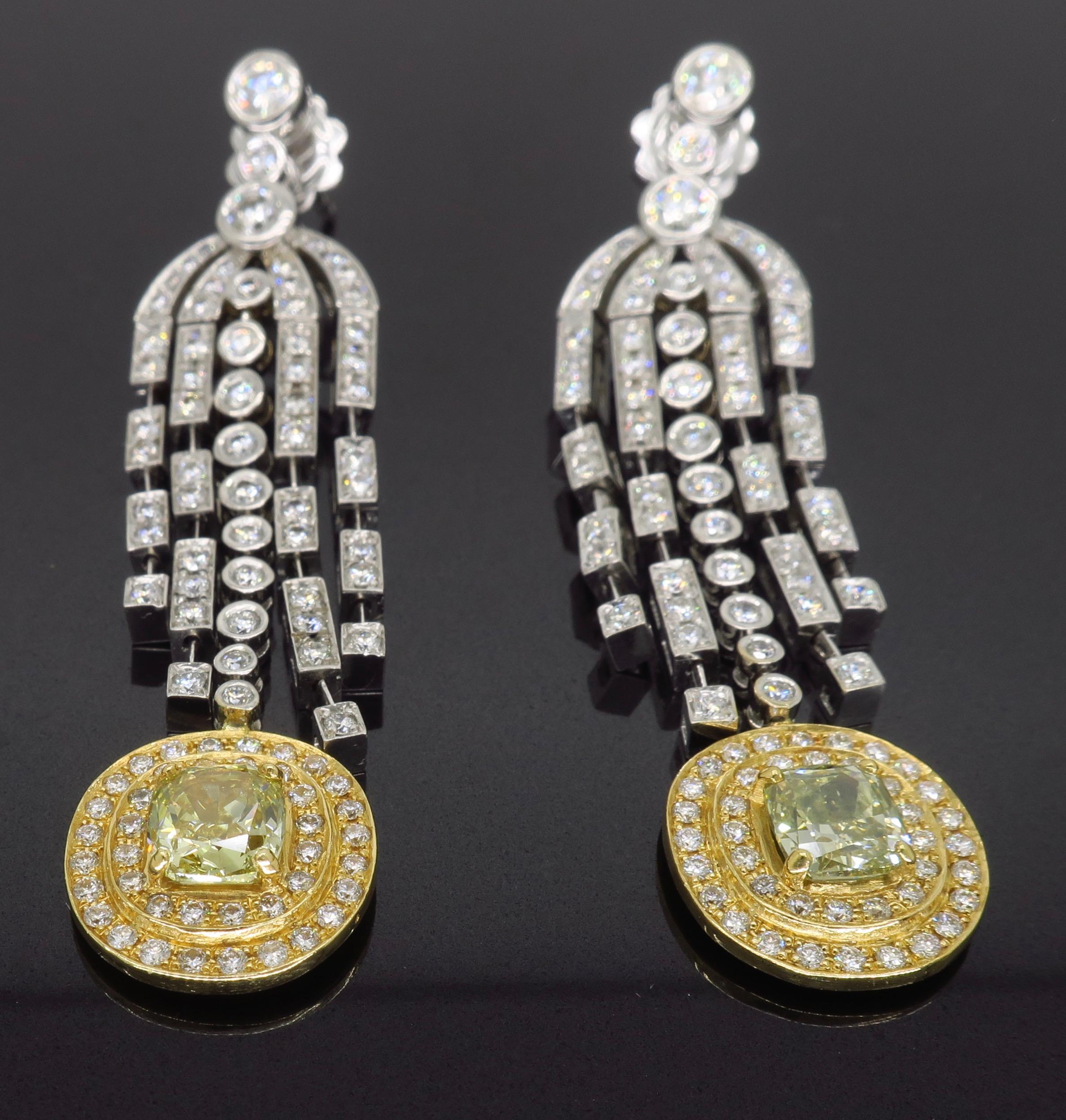 Fancy colored chandelier style diamond earrings crafted in 18k gold.
 
Center Diamond Carat Weight: Approximately .73CT and Approximately .69CT
Center Diamond Cut: Cushion Cut 
Center Diamond Color: Fancy Brownish Greenish Yellow
Center Diamond