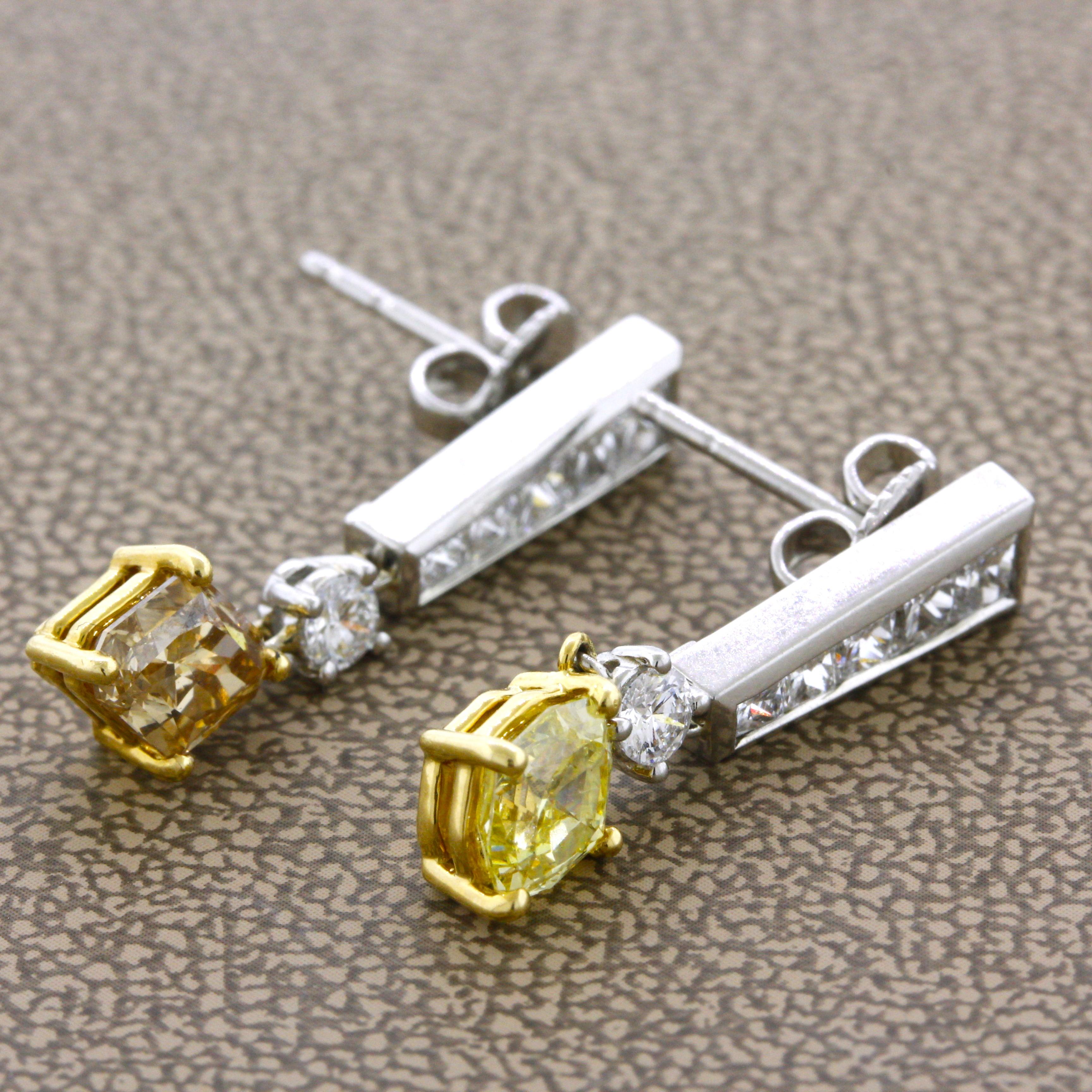 A lovely pair of miss-matched fancy colored diamond earrings. They feature 2 fancy colored diamonds with a specialty diamond-cut weighting 1.77 carats total. One of the diamonds has a bright fancy yellow color while the other is a fancy