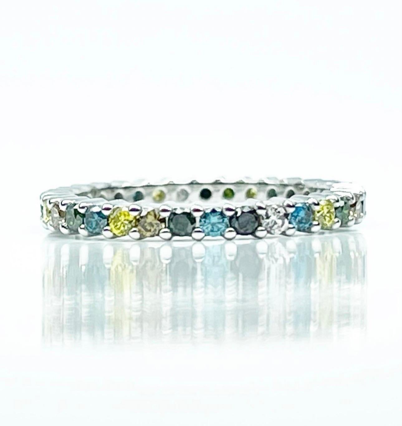 One of a kind diamond ring made with natural fancy diamonds, an array of colors in one eternity ring. Diamonds are VS-SI in clarity and colors are: Brown, Yellow, Blue, Black, Green and Gray.
Diamonds are enhanced with permanent color. The ring will