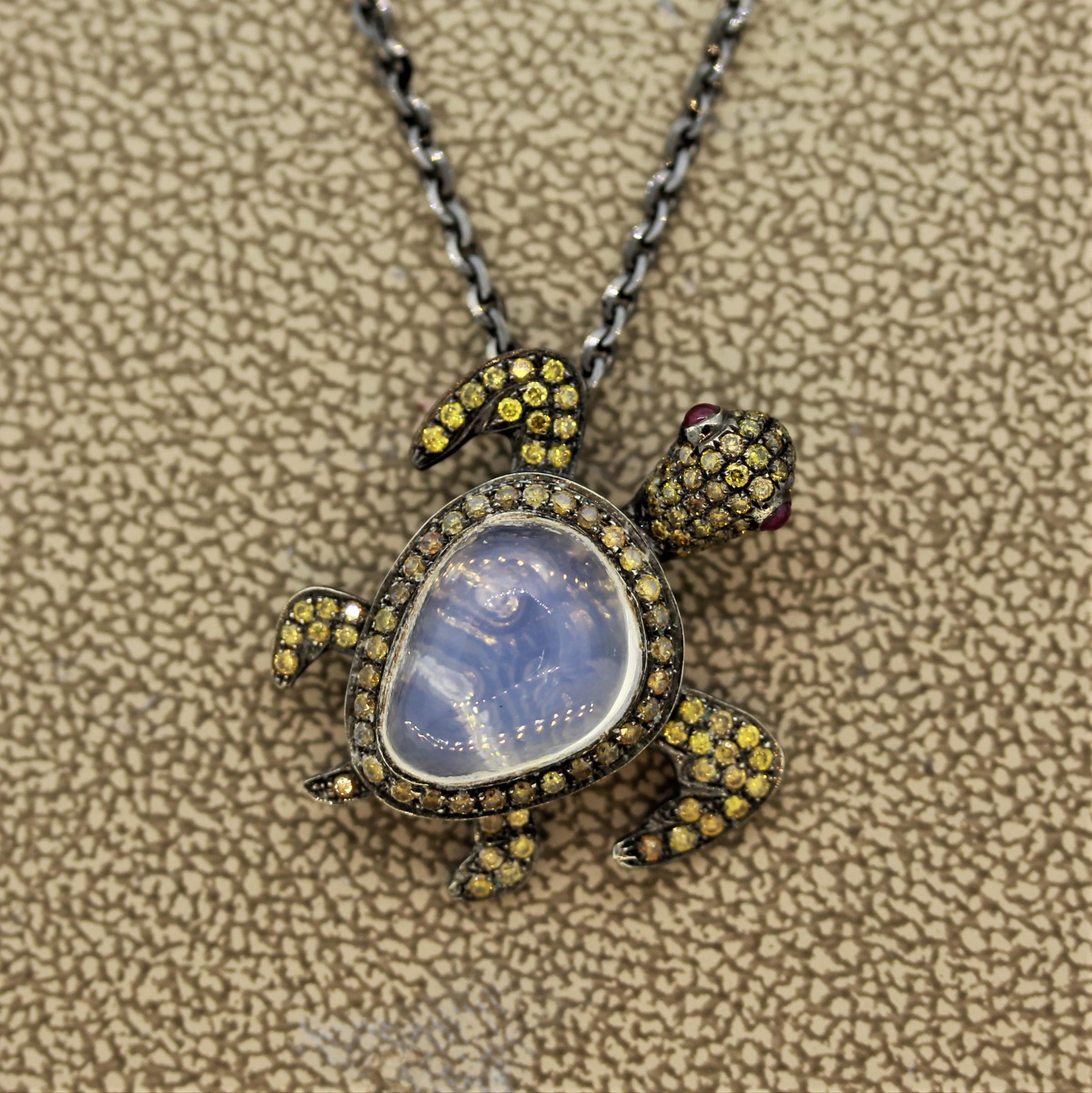 A fun piece featuring 0.62 carats of fancy colored diamonds, 2 cabochon rubies and a 4.03 carat opal. All these come together to create a cute and playful sea turtle! Made in 18k gold and finished with black rhodium to give the piece a black