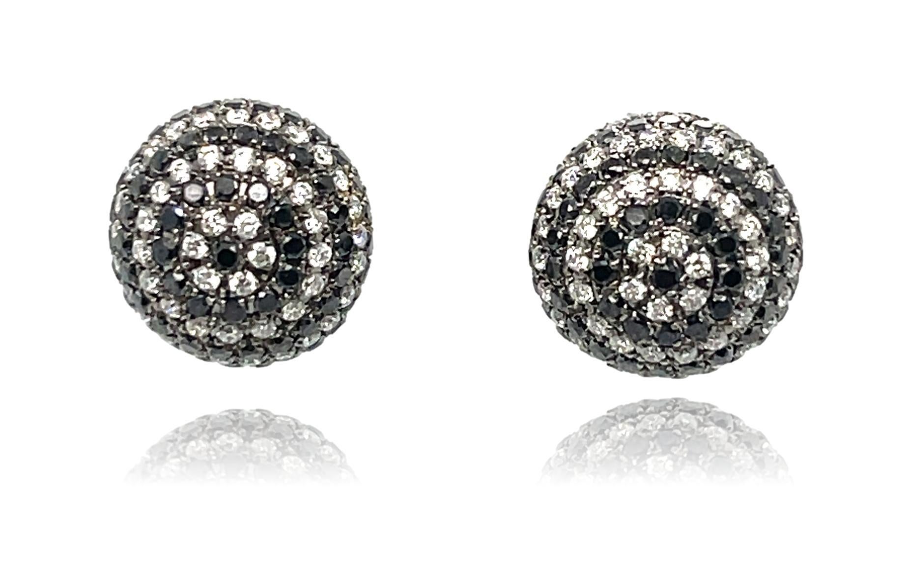 These stunning globe stud earrings are surrounded with natural black and brilliant cut white diamonds all set in 18K gold. They have double push back closure for extra security and snug fit. These earrings come in a beautiful box ready for the