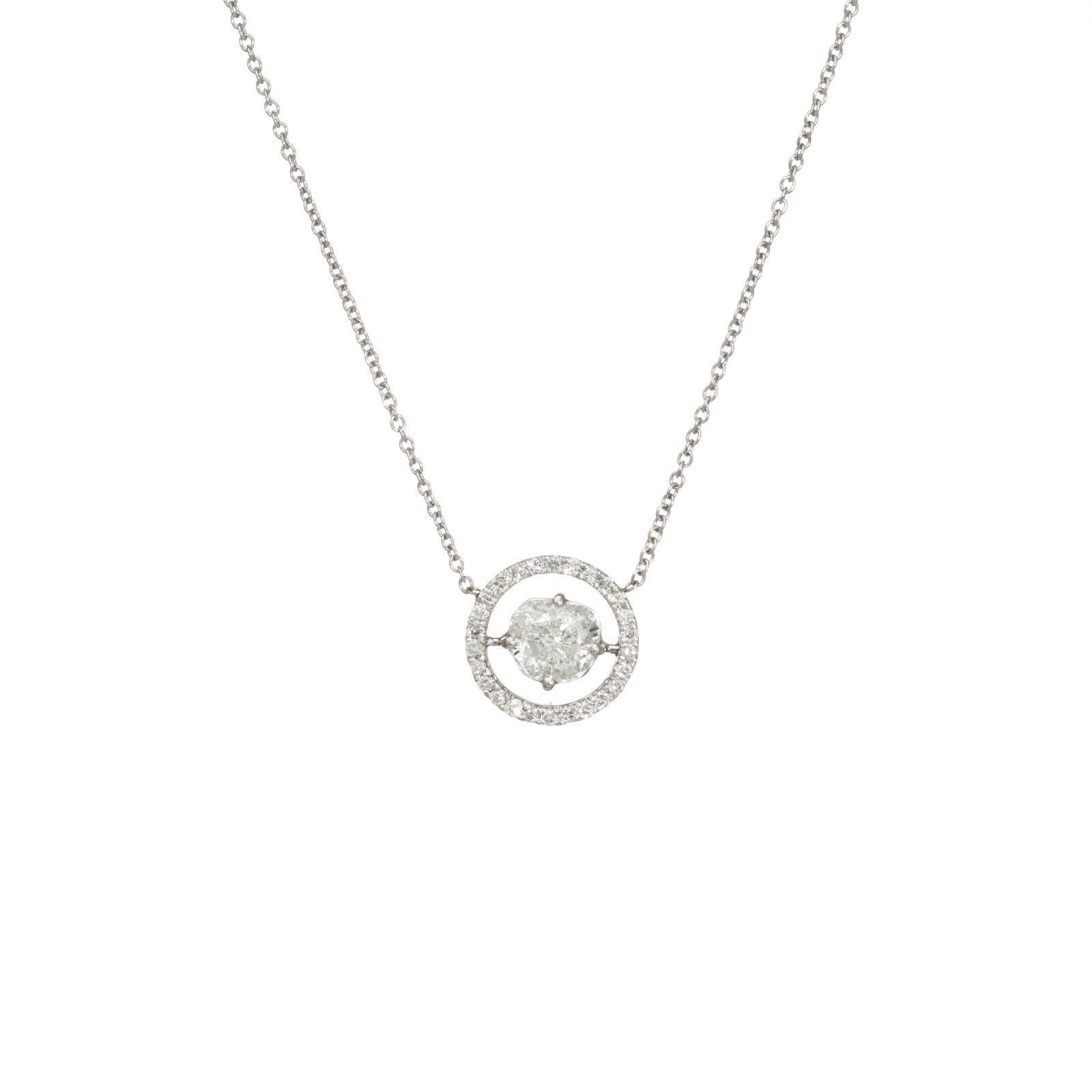 Stylish and finely detailed diamond halo necklace crafted in 14k white gold.  

Faceted brilliant cut (modified heart shape) is estimated at 0.80 carats, accented with 26 diamonds totaling an estimated 0.13 carats (estimated at I-J color and SI1-I2