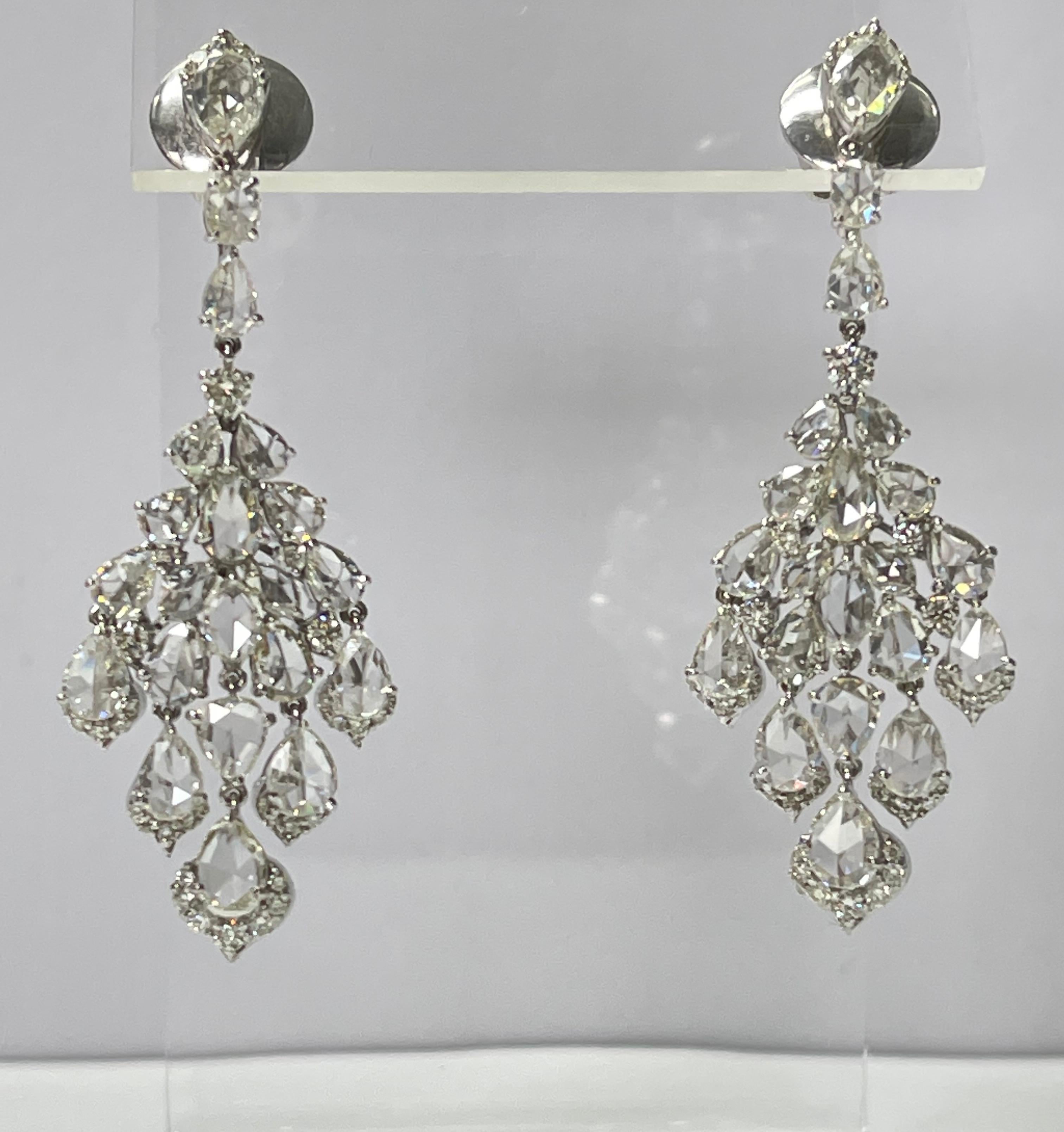 Power Perfection! These gorgeous fancy cut rose cut and round brilliant diamond chandelier earrings are handcrafted in 18k white gold. 
The details are as follows : 
Diamond weight : 7.02 carat ( HI color and VS clarity )
Metal : 18k white gold