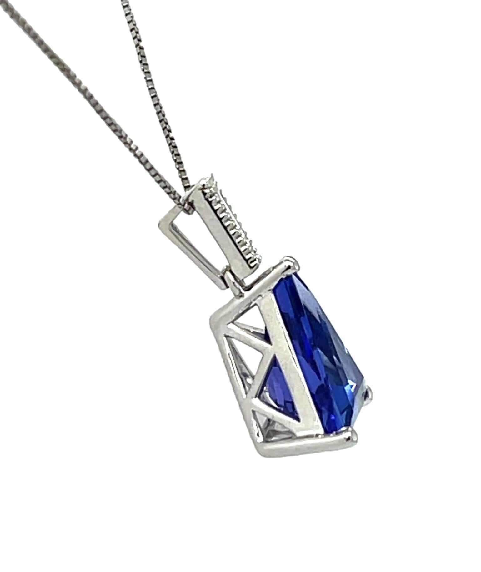 This stunning fancy cut trillion AAA quality Tanzanite pendant has a special cut elongated tapered baguette diamond on top. Comes with a gold chain. It comes in a beautiful box ready for the perfect gift!

18KW: 1.60 gms
Tanz wt: 3.36 cts
Tanz