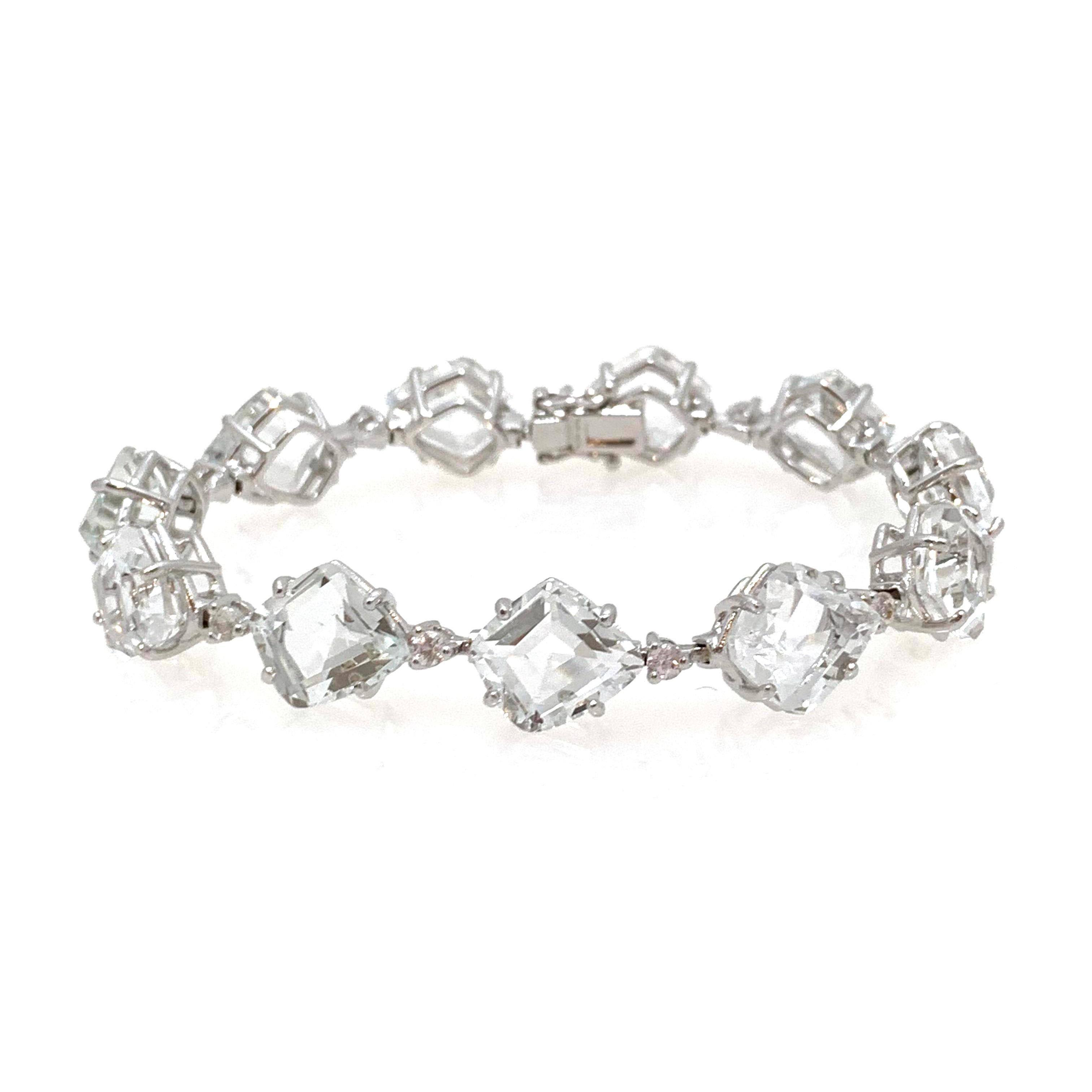 Classic with a twist! Fancy-cut White Topaz and White Sapphire Tennis Bracelet.

This bracelet features 22pcs of genuine fancy-cut white topaz and round white sapphire, handset in platinum rhodium plate sterling silver, push clasp with '8' safety